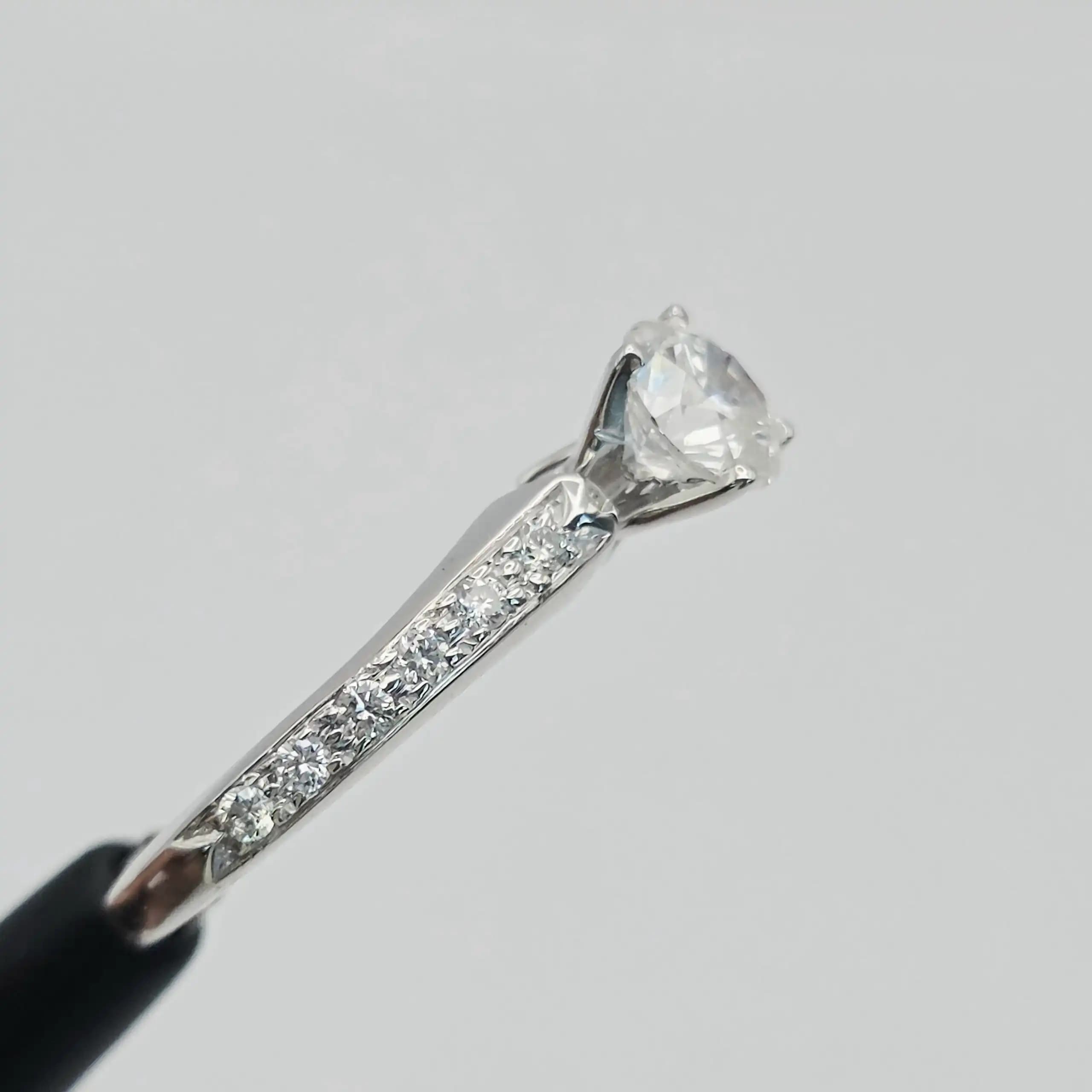 0.70 cts round natural diamond solitaire ring with pave shoulders in 14K white gold