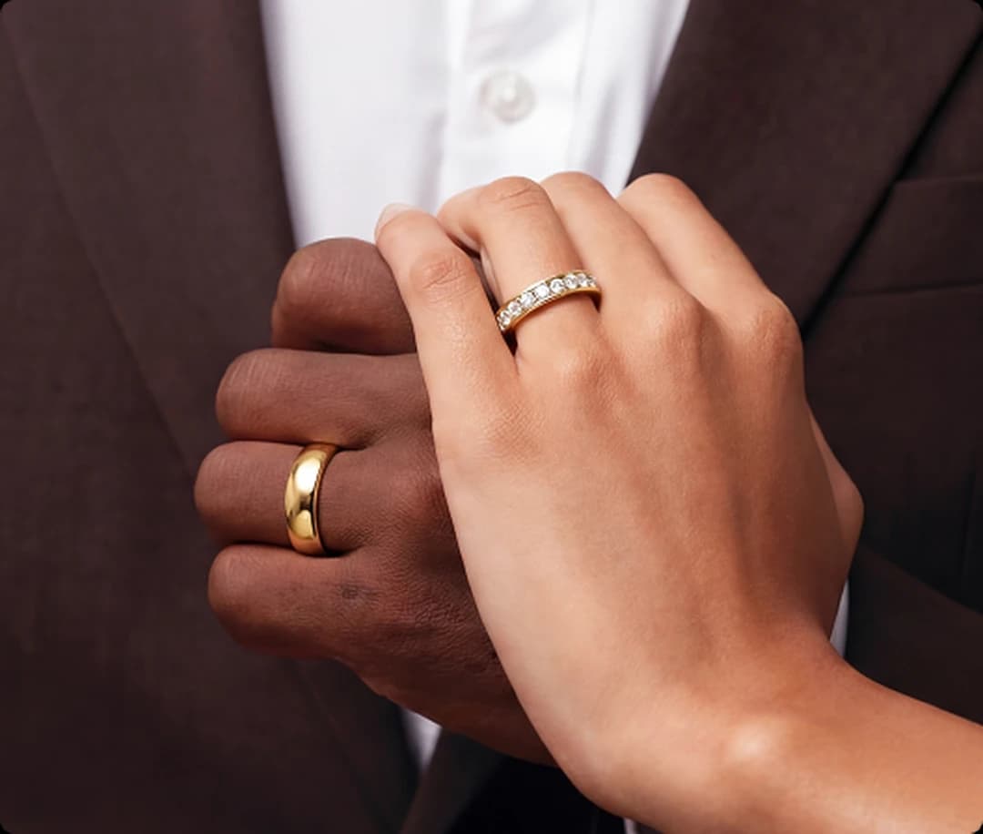 A solitaire diamond engagement ring in yellow gold