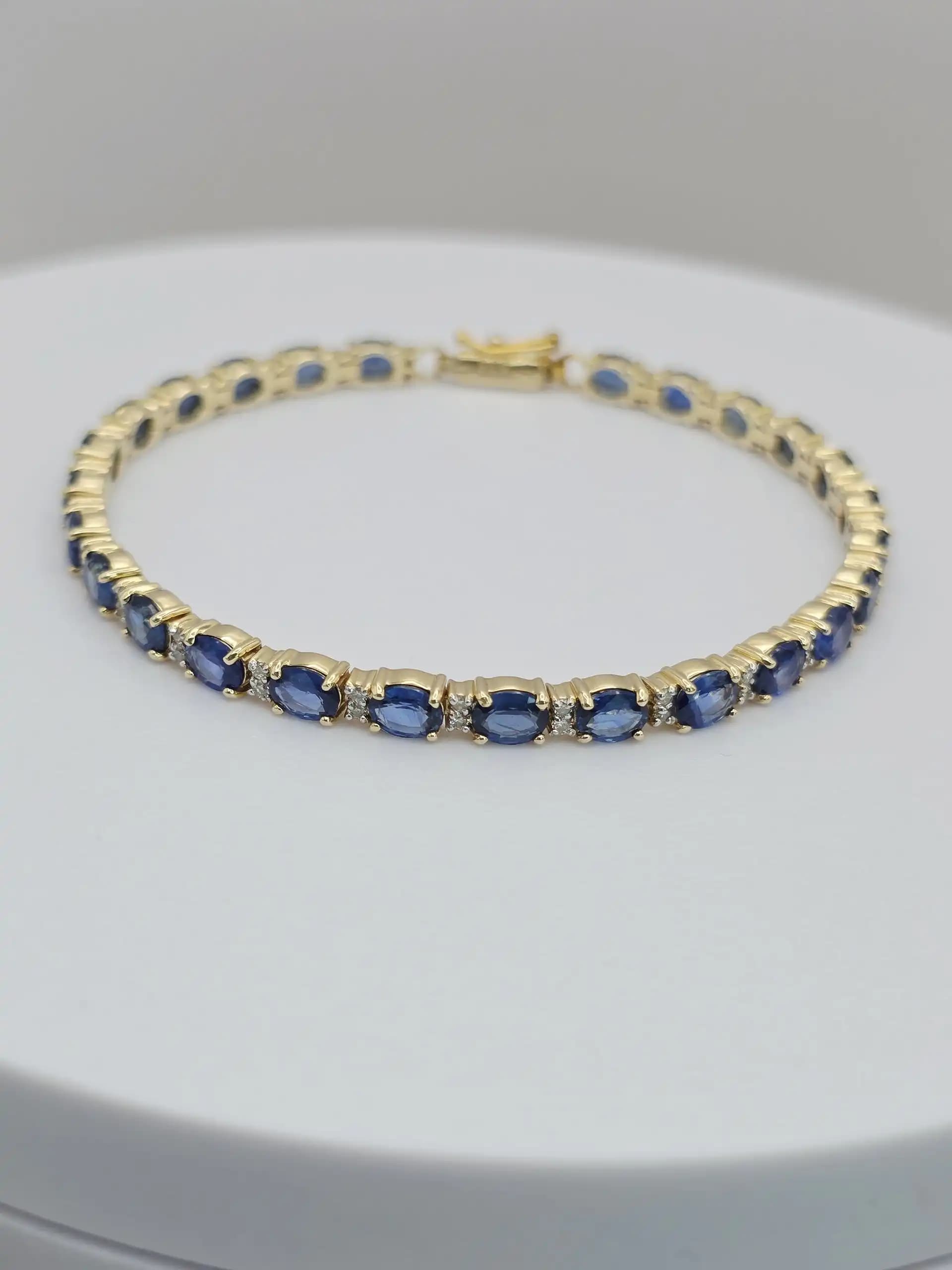 1.97 cts oval natural blue sapphire and diamond tennis bracelet in 14K yellow gold