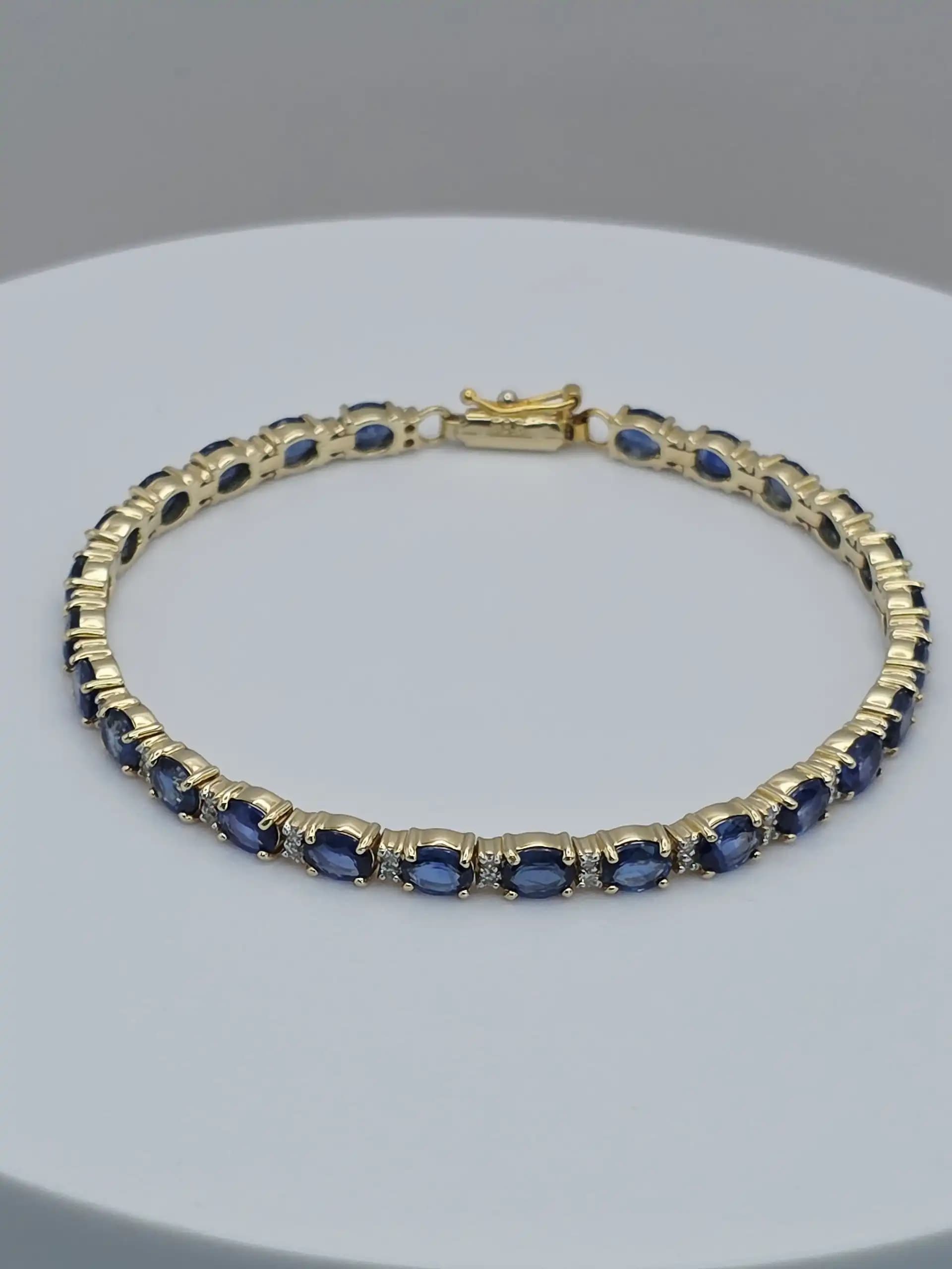 1.97 cts oval natural blue sapphire and diamond tennis bracelet in 14K yellow gold