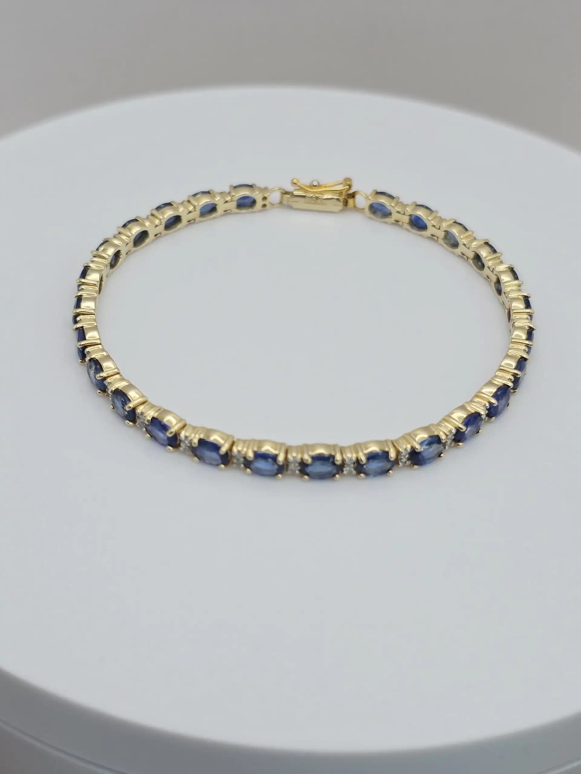 1.97 cts oval natural blue sapphire and diamond tennis bracelet in 14K yellow gold