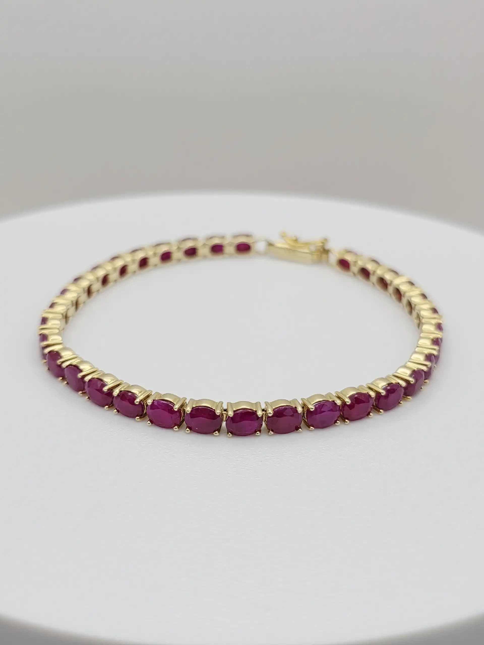 15.00 cts oval natural ruby tennis bracelet in 14K yellow gold