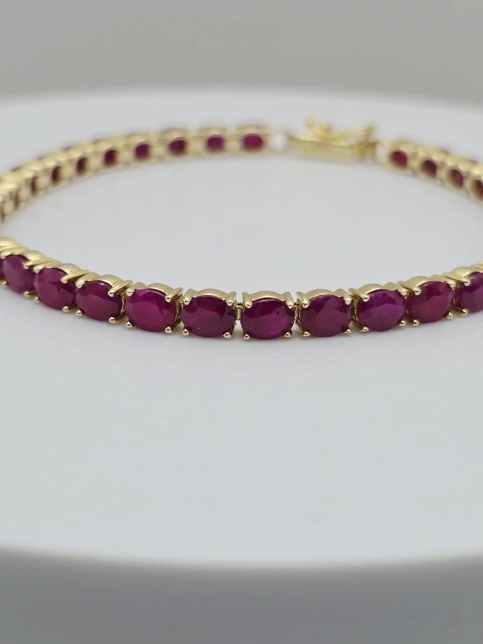15.00 cts oval natural ruby tennis bracelet in 14K yellow gold