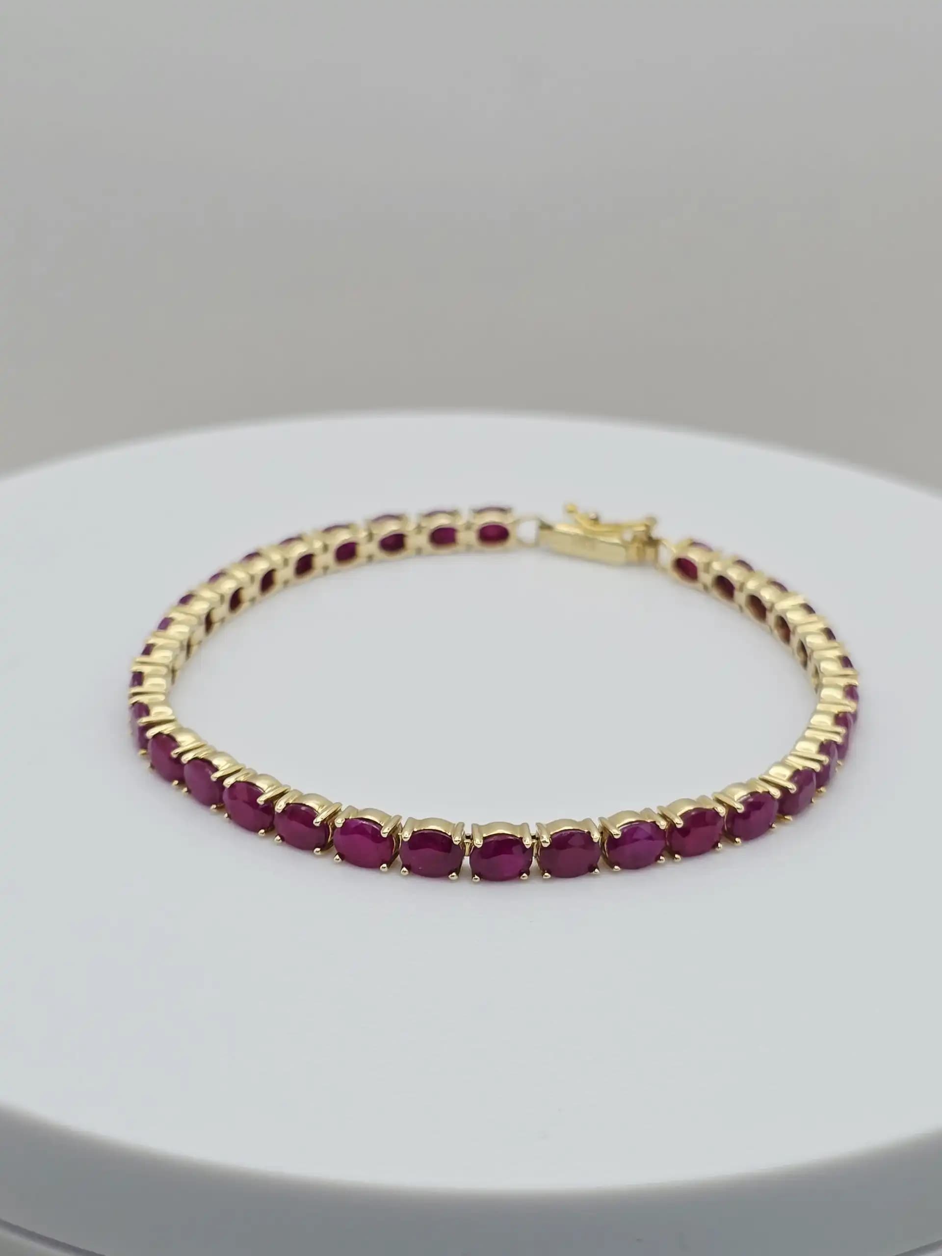 15.00 cts oval natural ruby tennis bracelet in 14K yellow gold