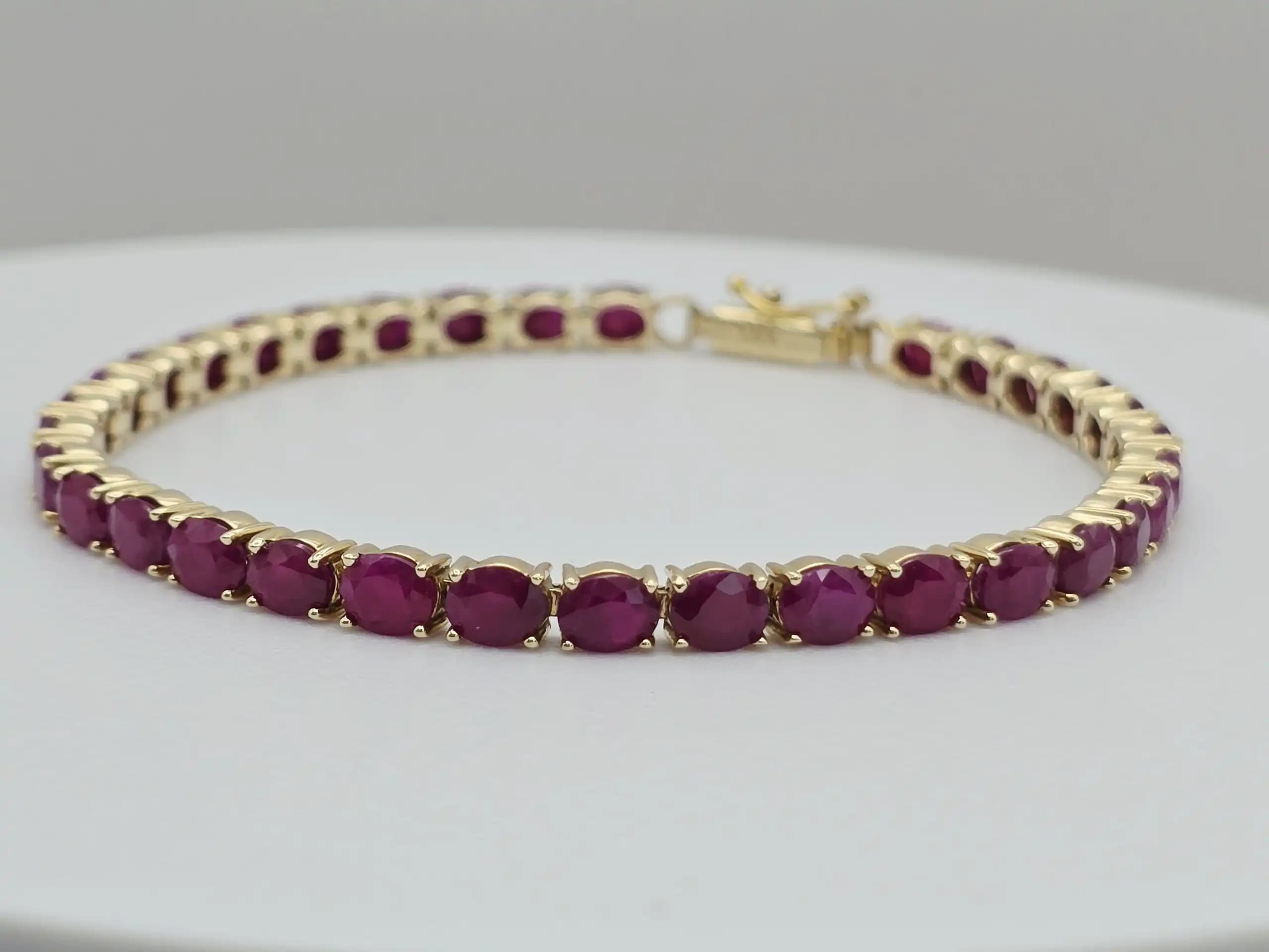 15.00 cts oval natural ruby tennis bracelet in 14K yellow gold