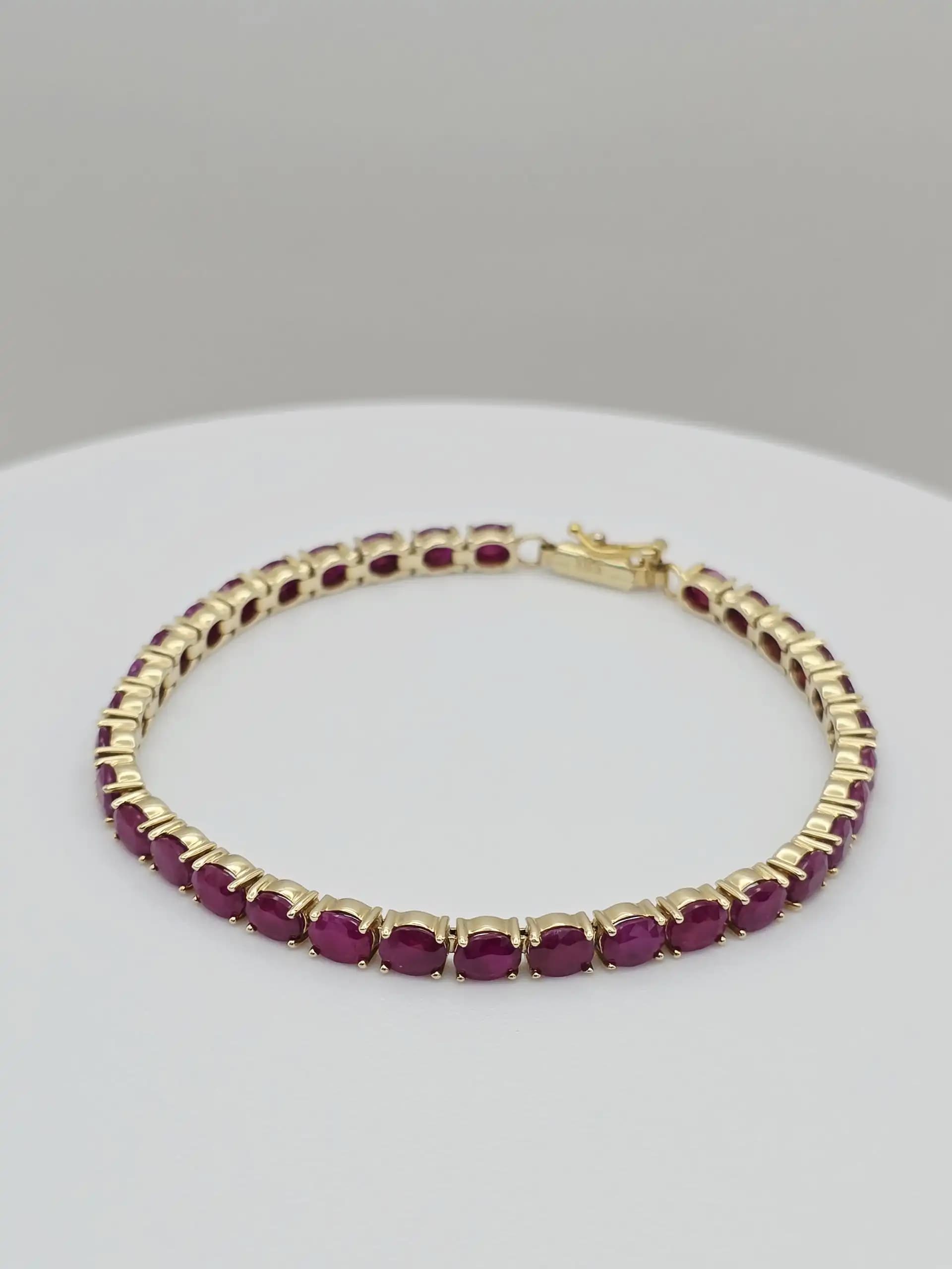 15.00 cts oval natural ruby tennis bracelet in 14K yellow gold