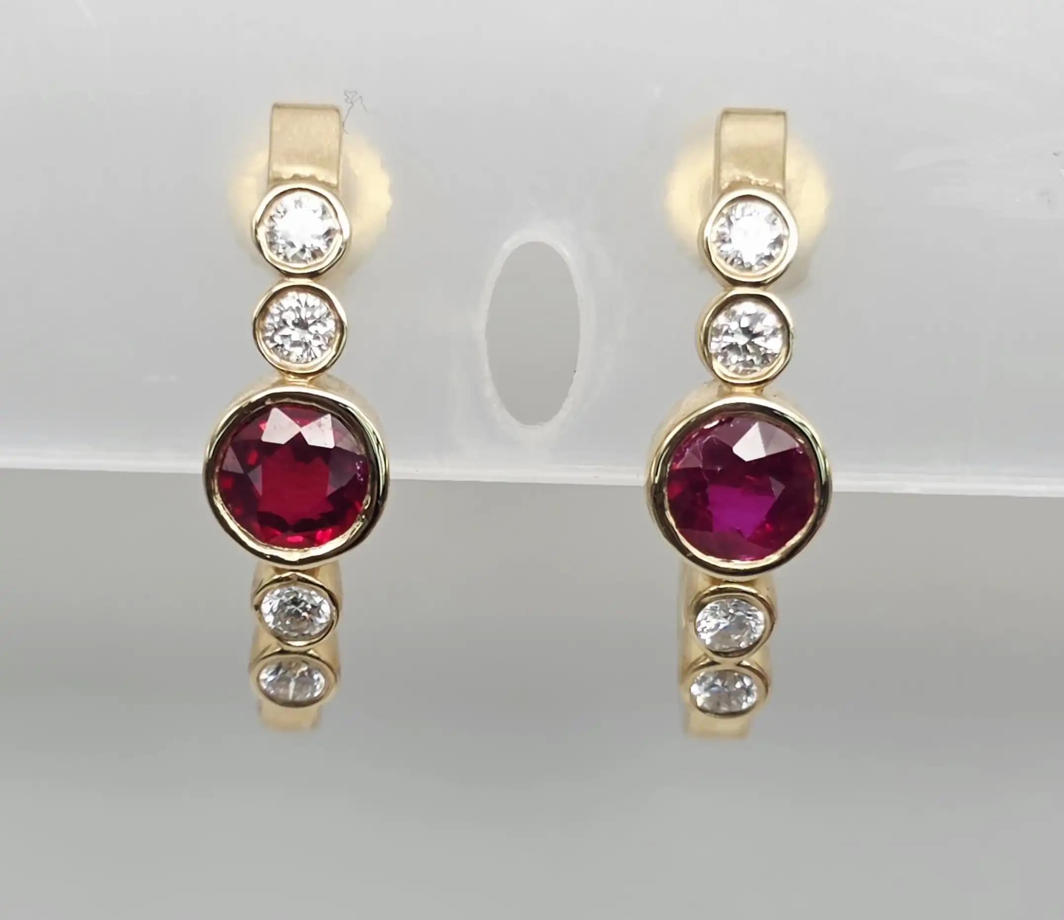 1.12 cts round natural ruby and diamond curved hoop earrings in 14K yellow gold