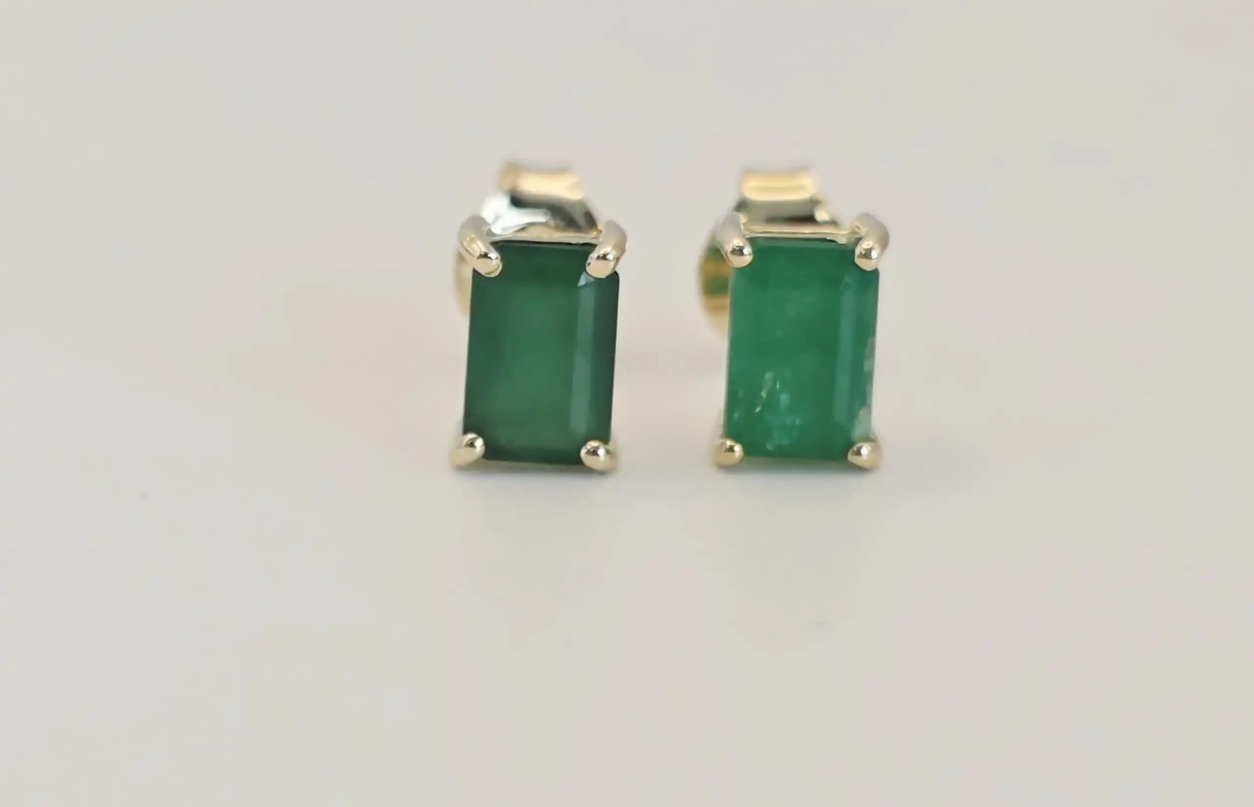 0.50 cts emerald cut natural emerald stud earrings in 14K yellow gold
