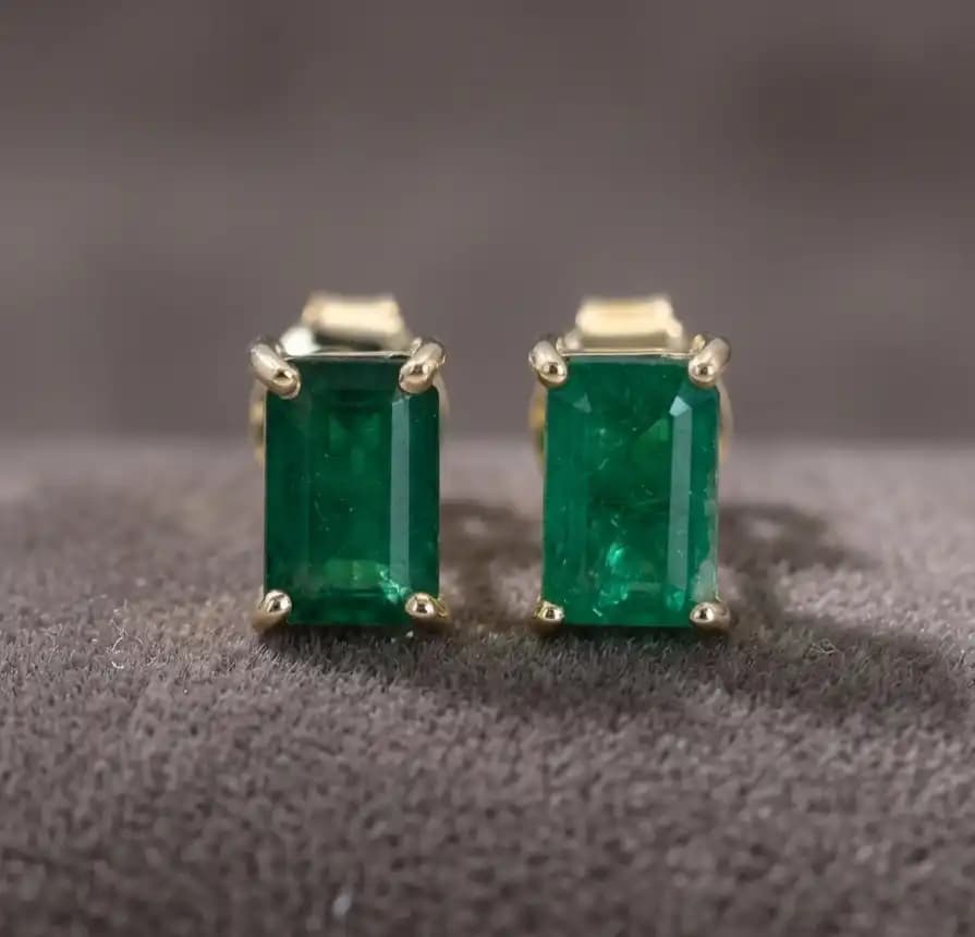 0.50 cts emerald cut natural emerald stud earrings in 14K yellow gold