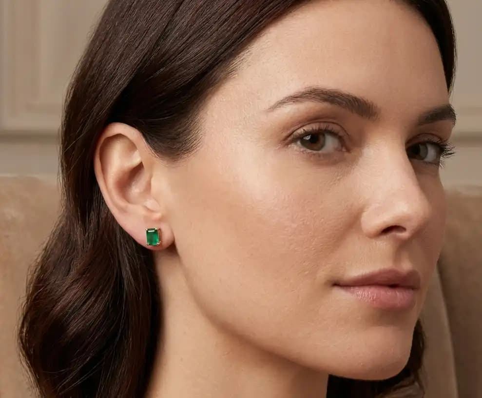 0.50 cts emerald cut natural emerald stud earrings in 14K yellow gold