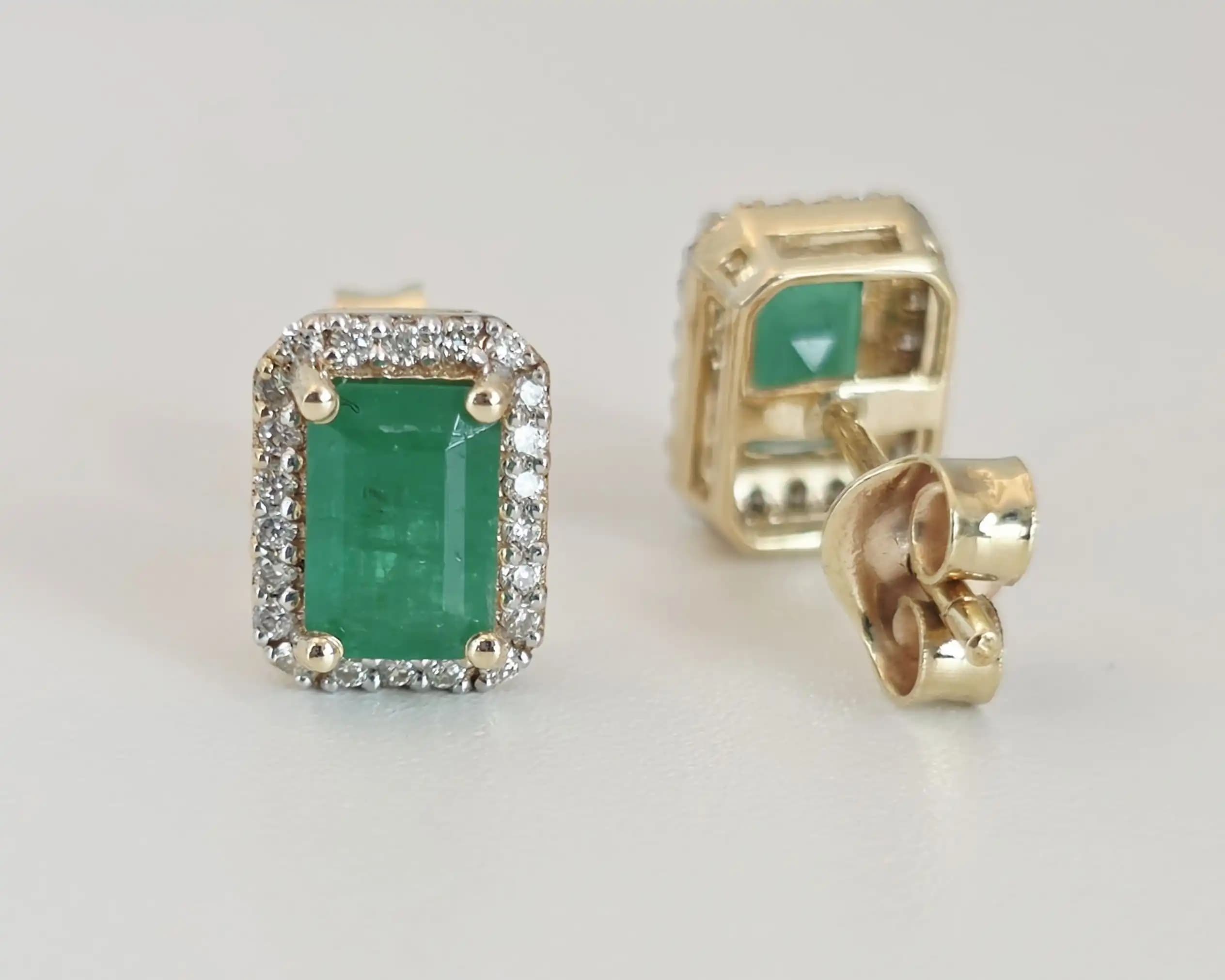 1.16 cts emerald cut natural emerald halo stud earrings in 14K yellow gold