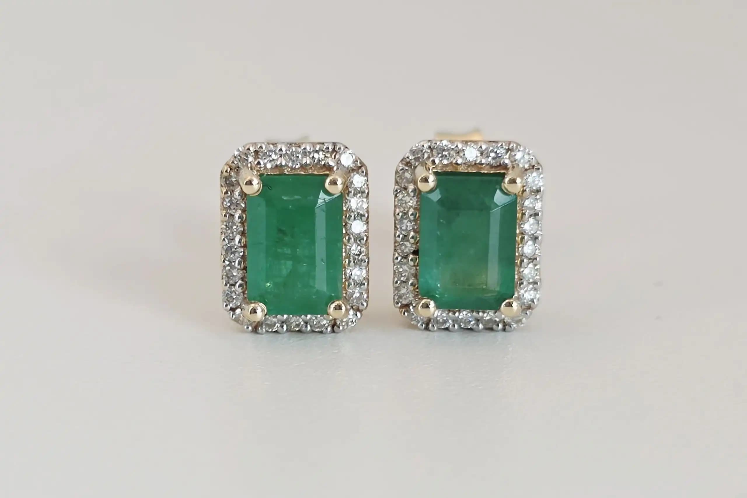 1.16 cts emerald cut natural emerald halo stud earrings in 14K yellow gold