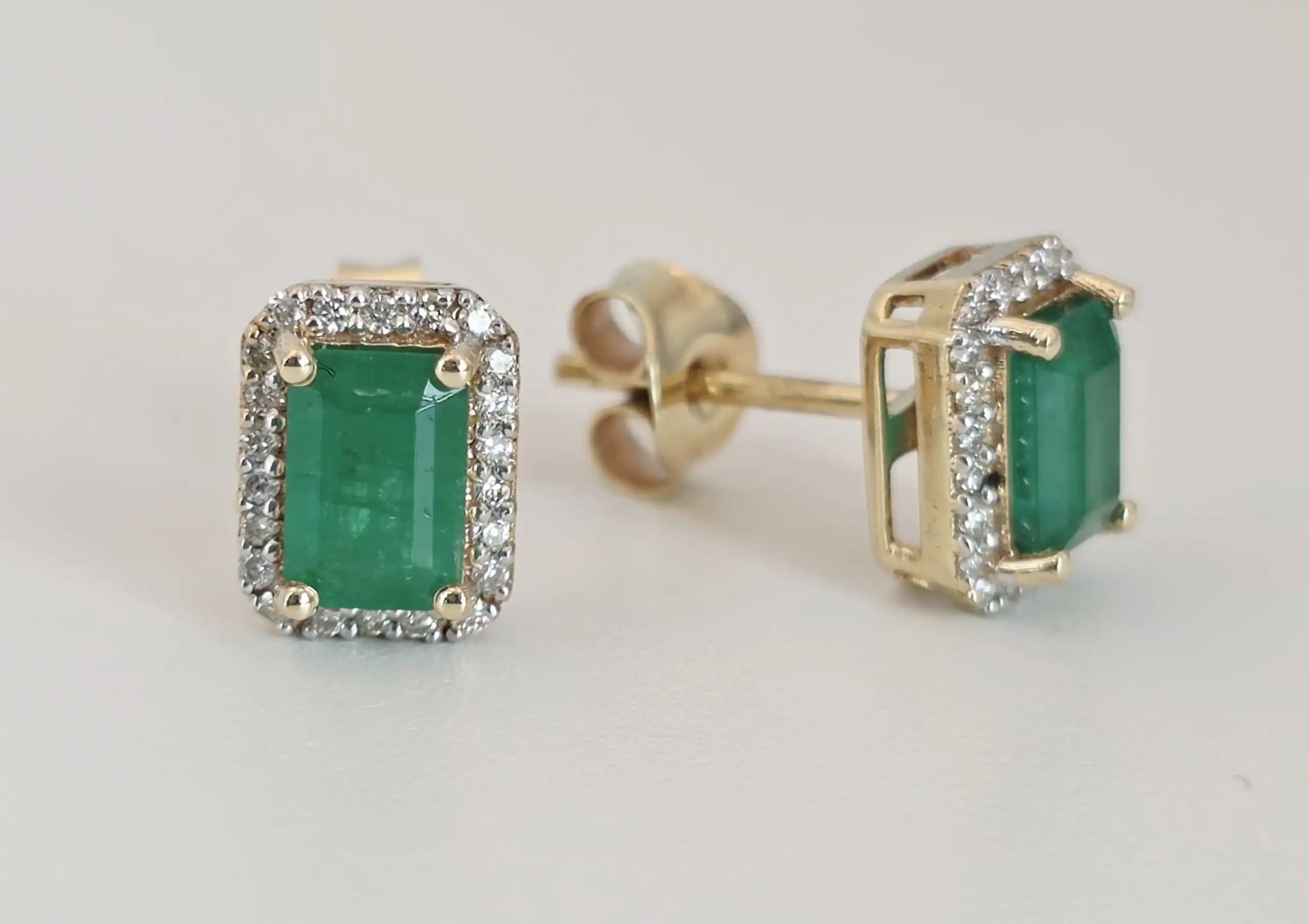 1.16 cts emerald cut natural emerald halo stud earrings in 14K yellow gold