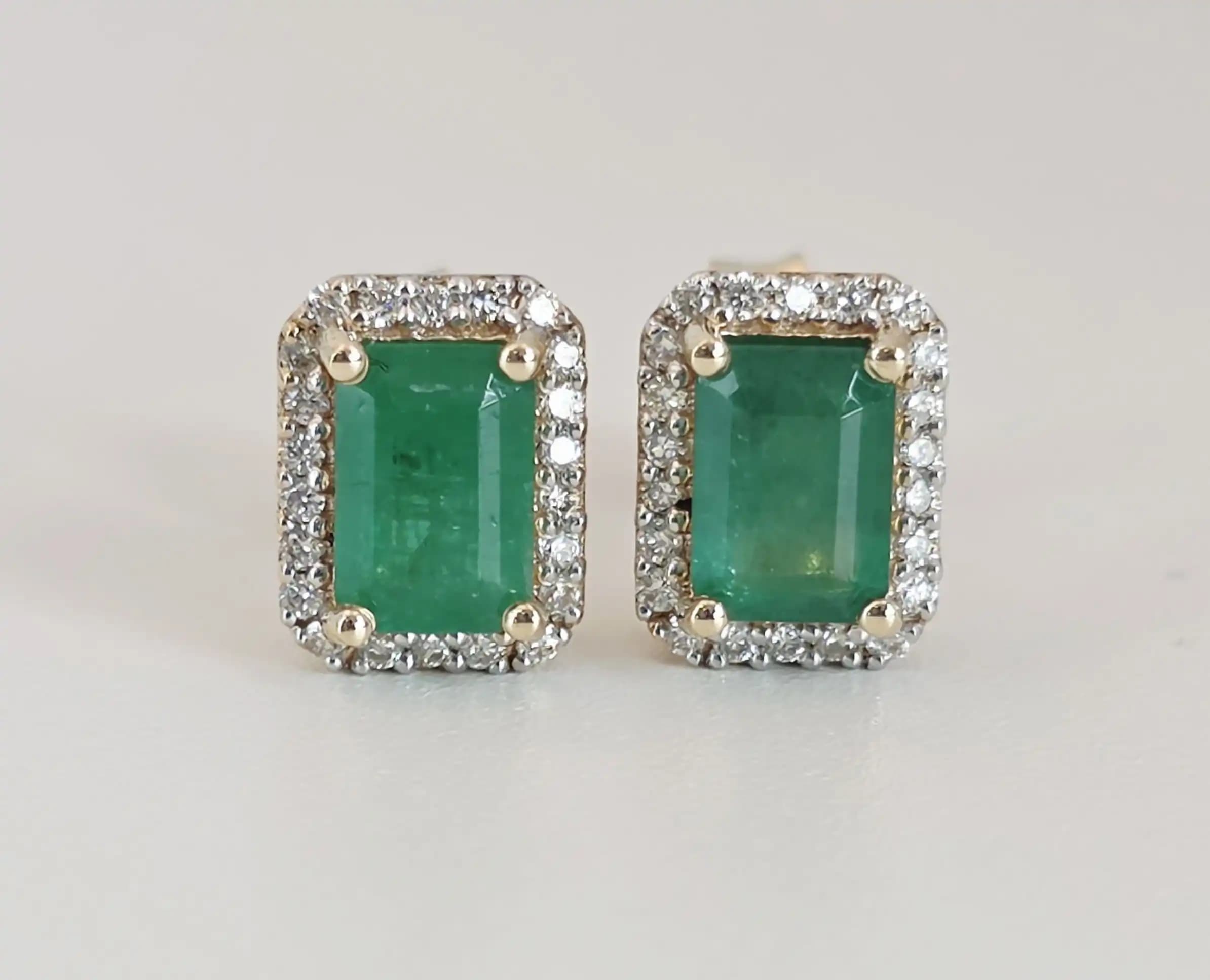 1.16 cts emerald cut natural emerald halo stud earrings in 14K yellow gold