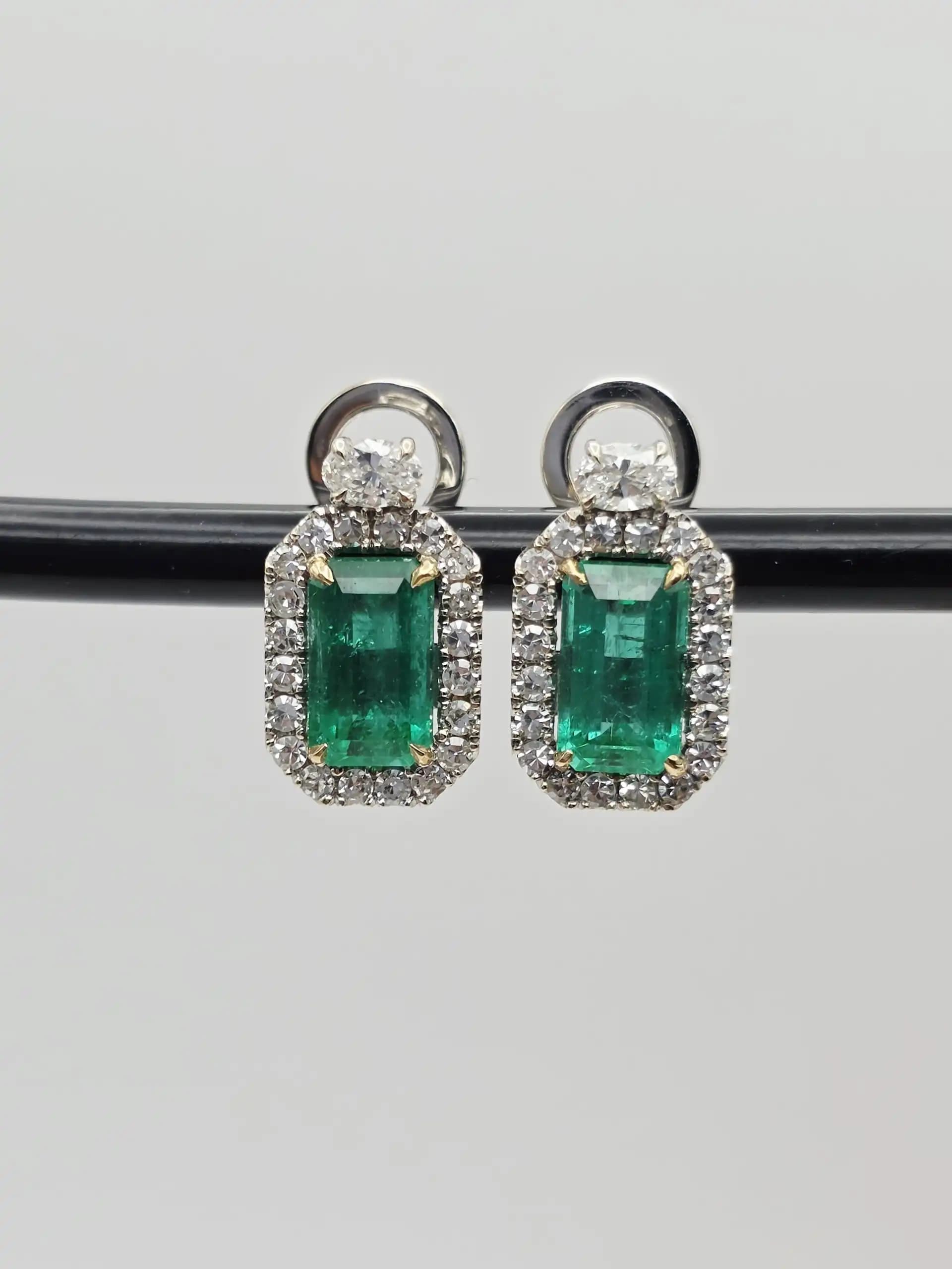 5.00 cts emerald cut natural emerald and diamond halo earrings in 18K white gold
