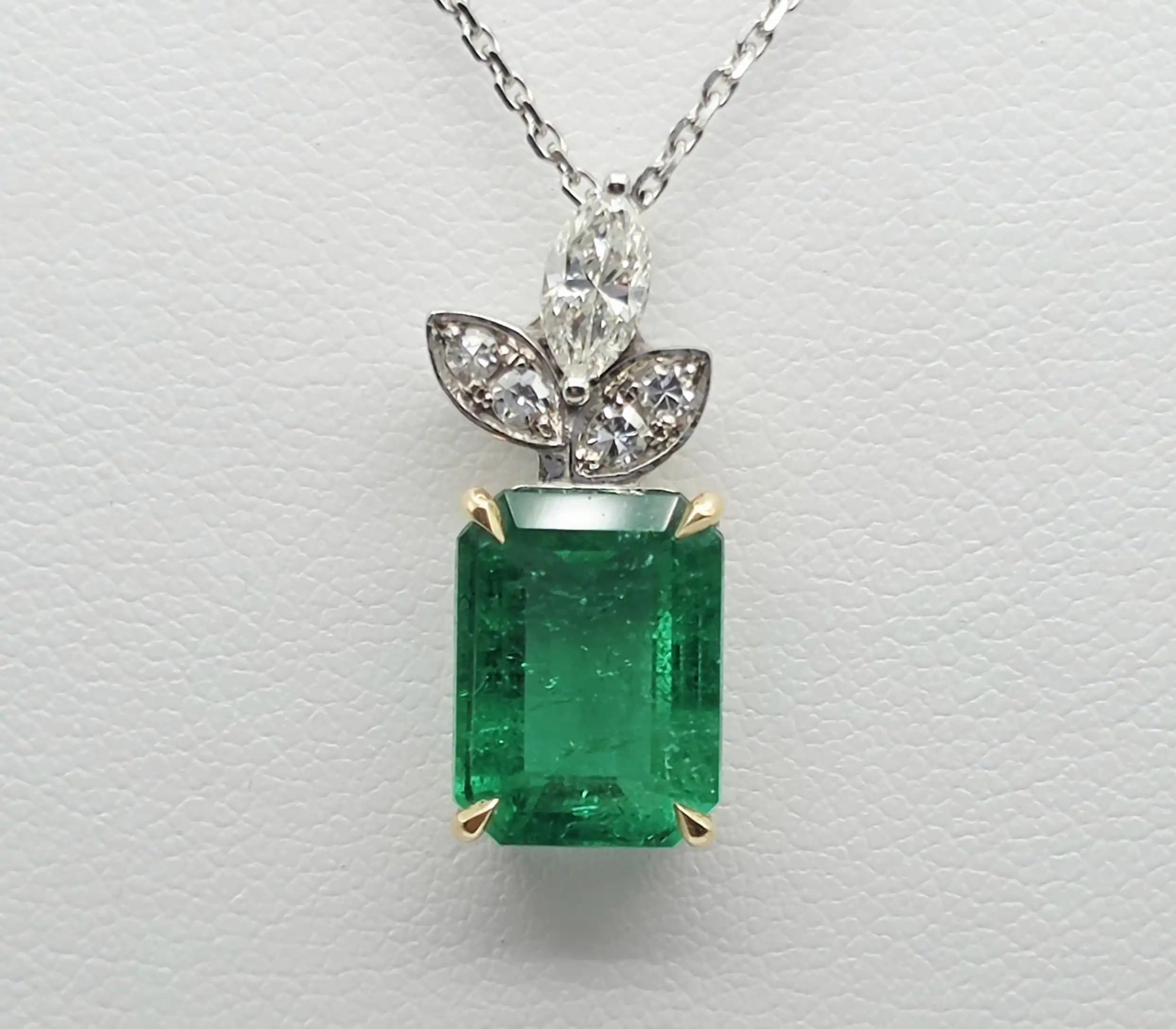 2.48 cts emerald cut natural emerald and diamond pendant in 18K white gold