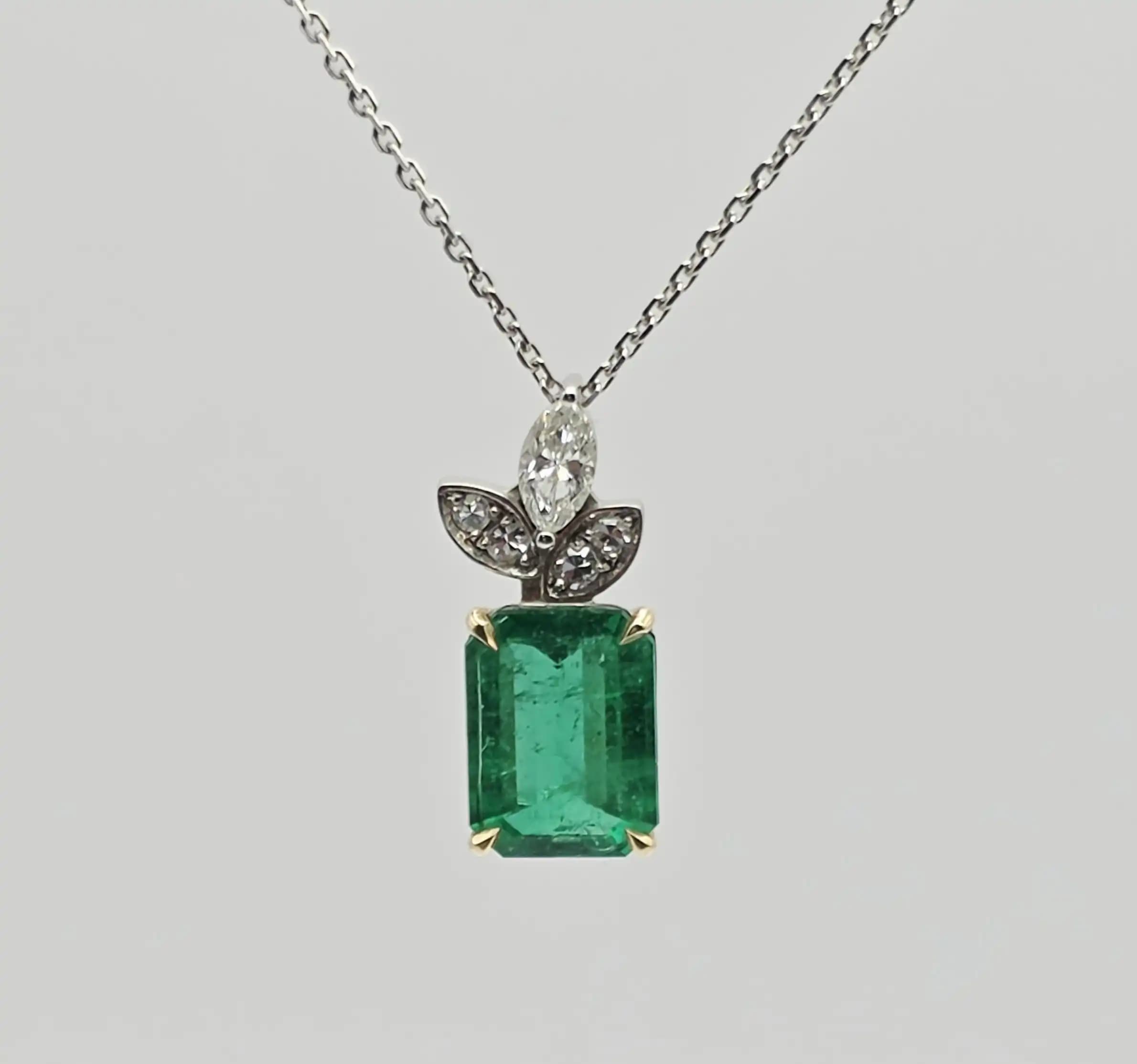 2.48 cts emerald cut natural emerald and diamond pendant in 18K white gold
