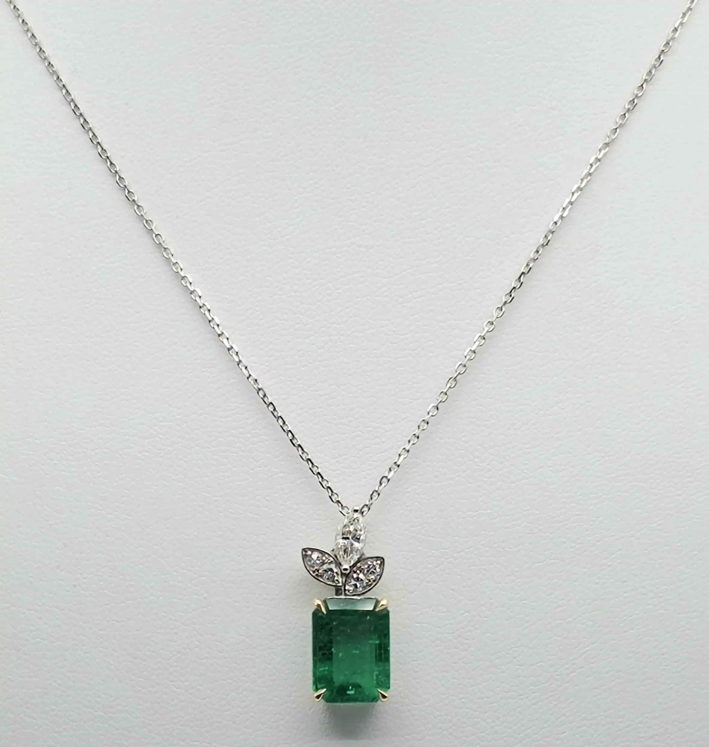 2.48 cts emerald cut natural emerald and diamond pendant in 18K white gold