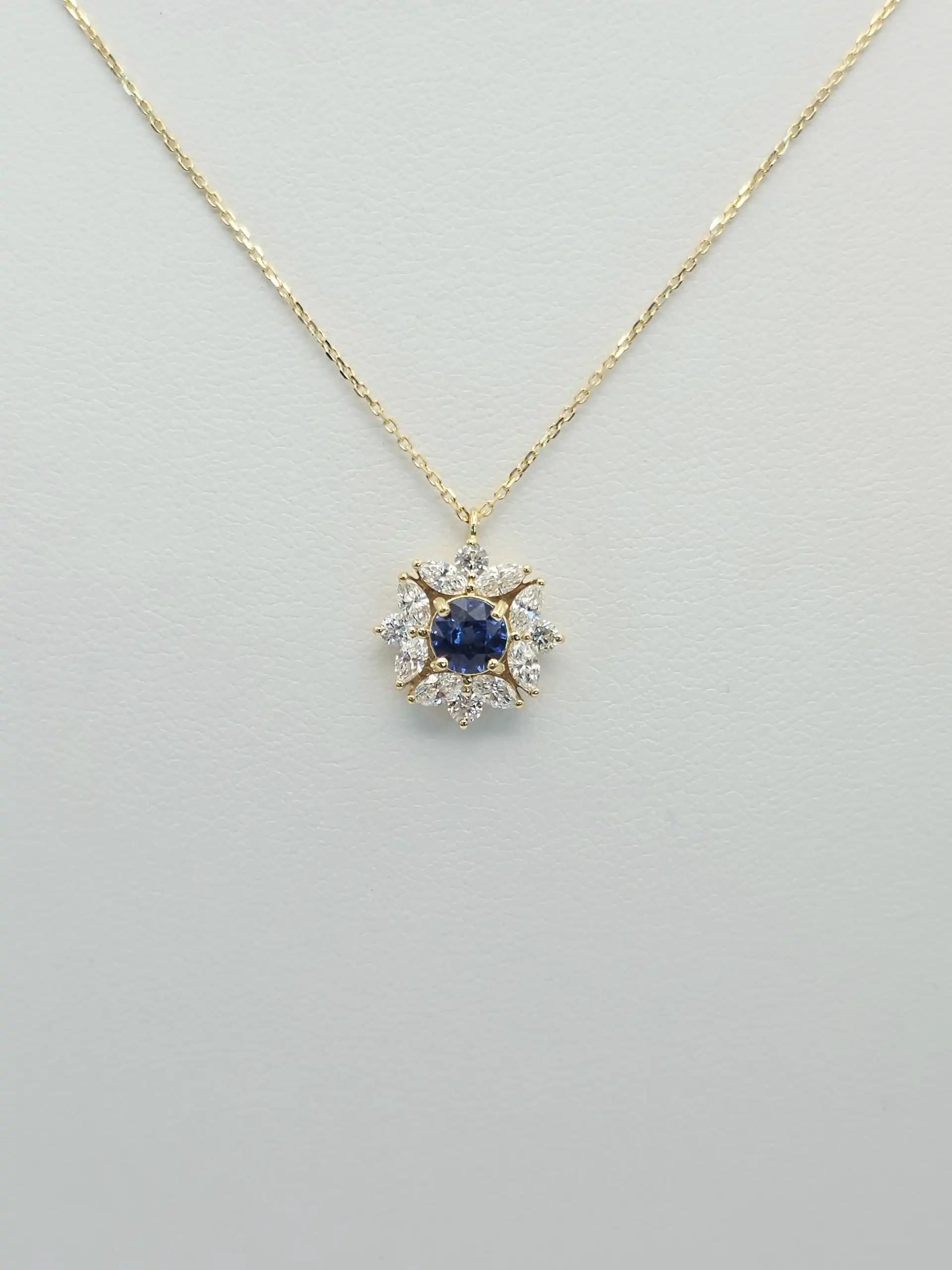 0.63 cts round natural blue sapphire and diamond cluster pendant in 18K yellow gold