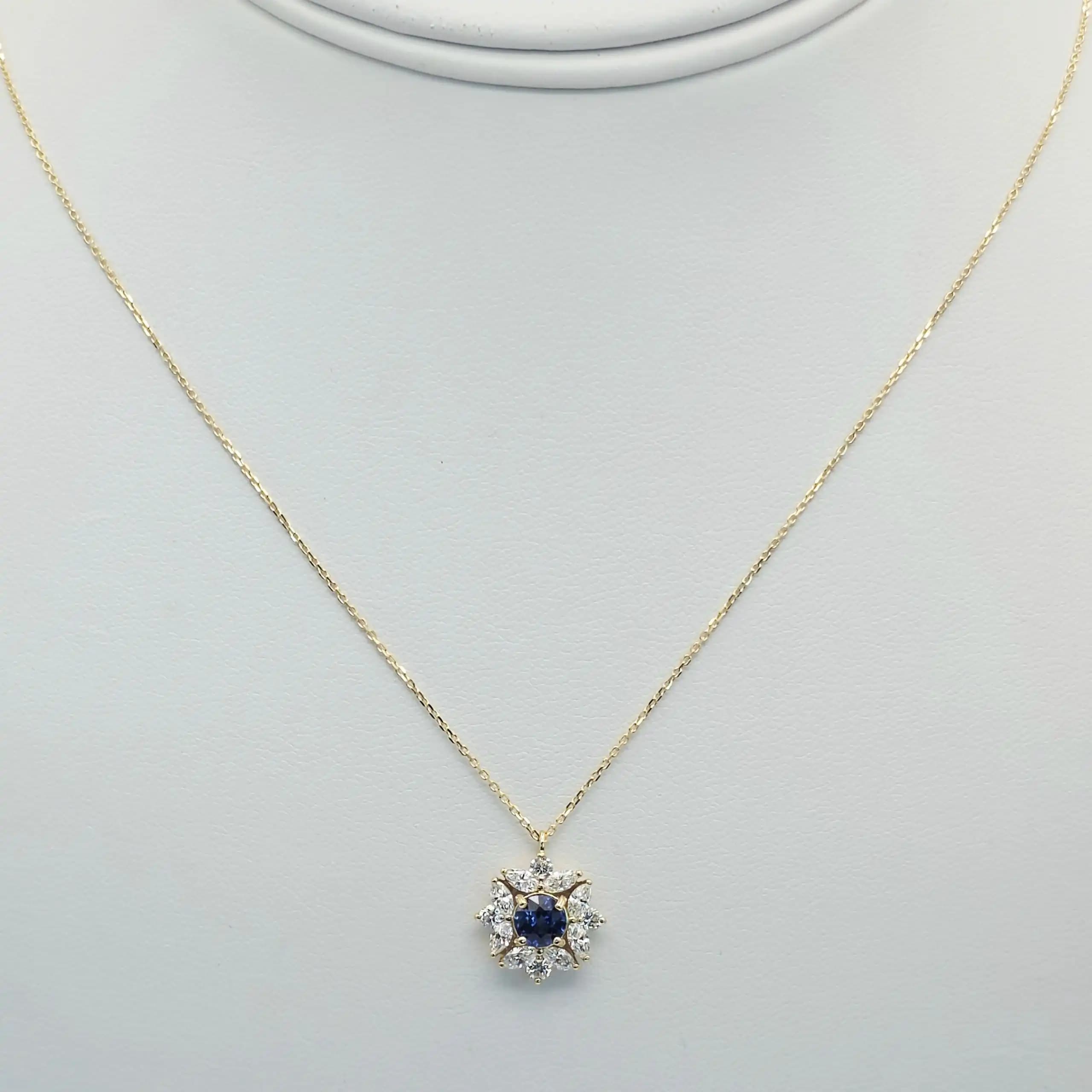 0.63 cts round natural blue sapphire and diamond cluster pendant in 18K yellow gold