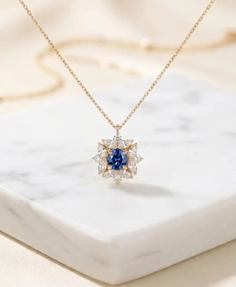 0.63 cts round natural blue sapphire and diamond cluster pendant in 18K yellow gold