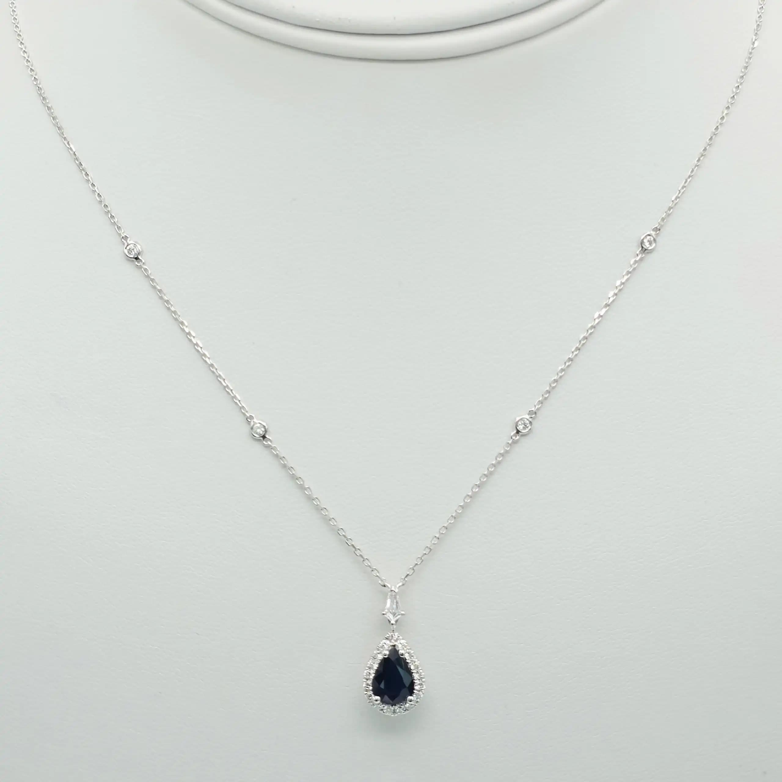 0.98 cts pear shape natural blue sapphire halo pendant necklace in 18K white gold