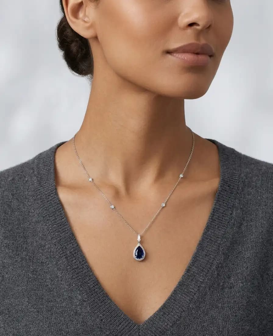 0.98 cts pear shape natural blue sapphire halo pendant necklace in 18K white gold