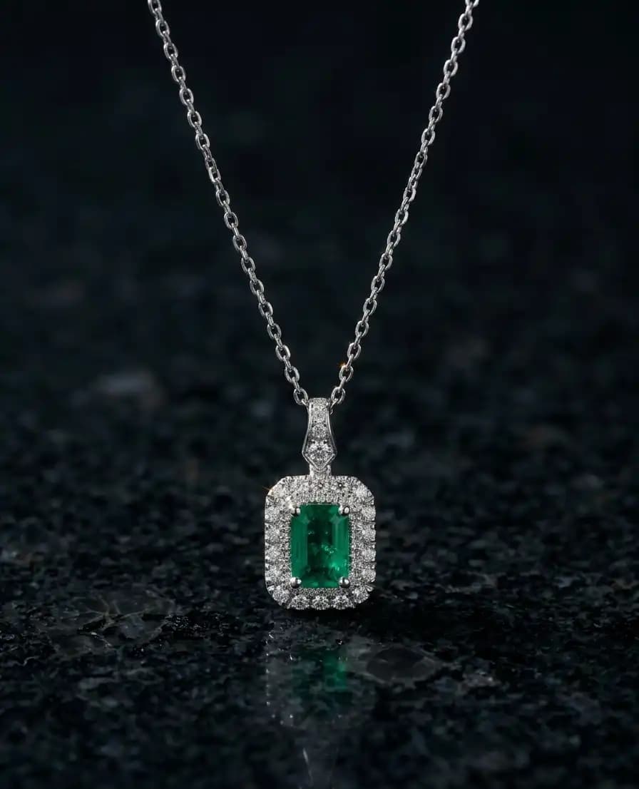 0.84 cts emerald cut natural emerald halo pendant in 18K white gold