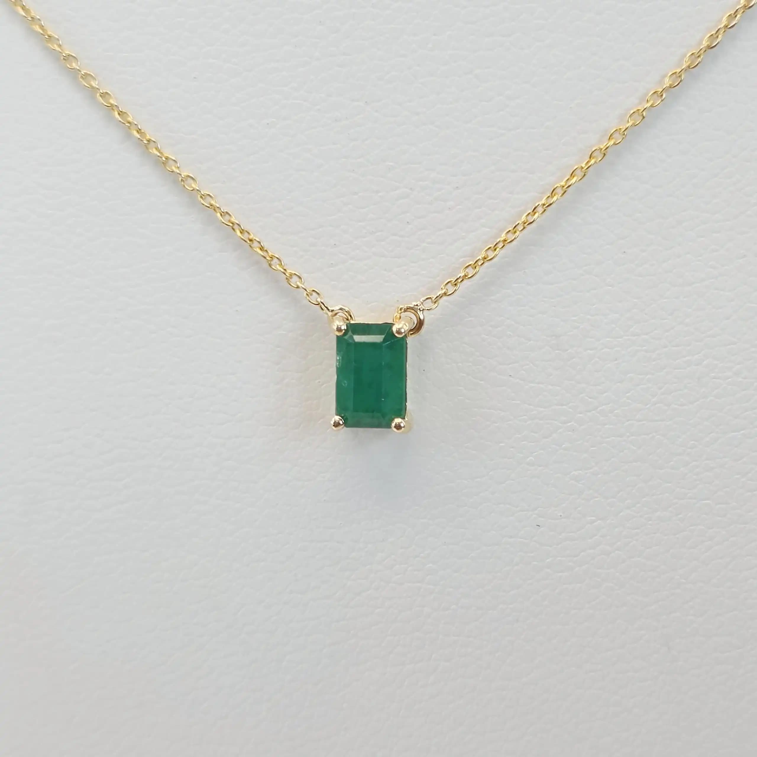 0.50 cts emerald cut natural emerald floating solitaire necklace in 14K yellow gold