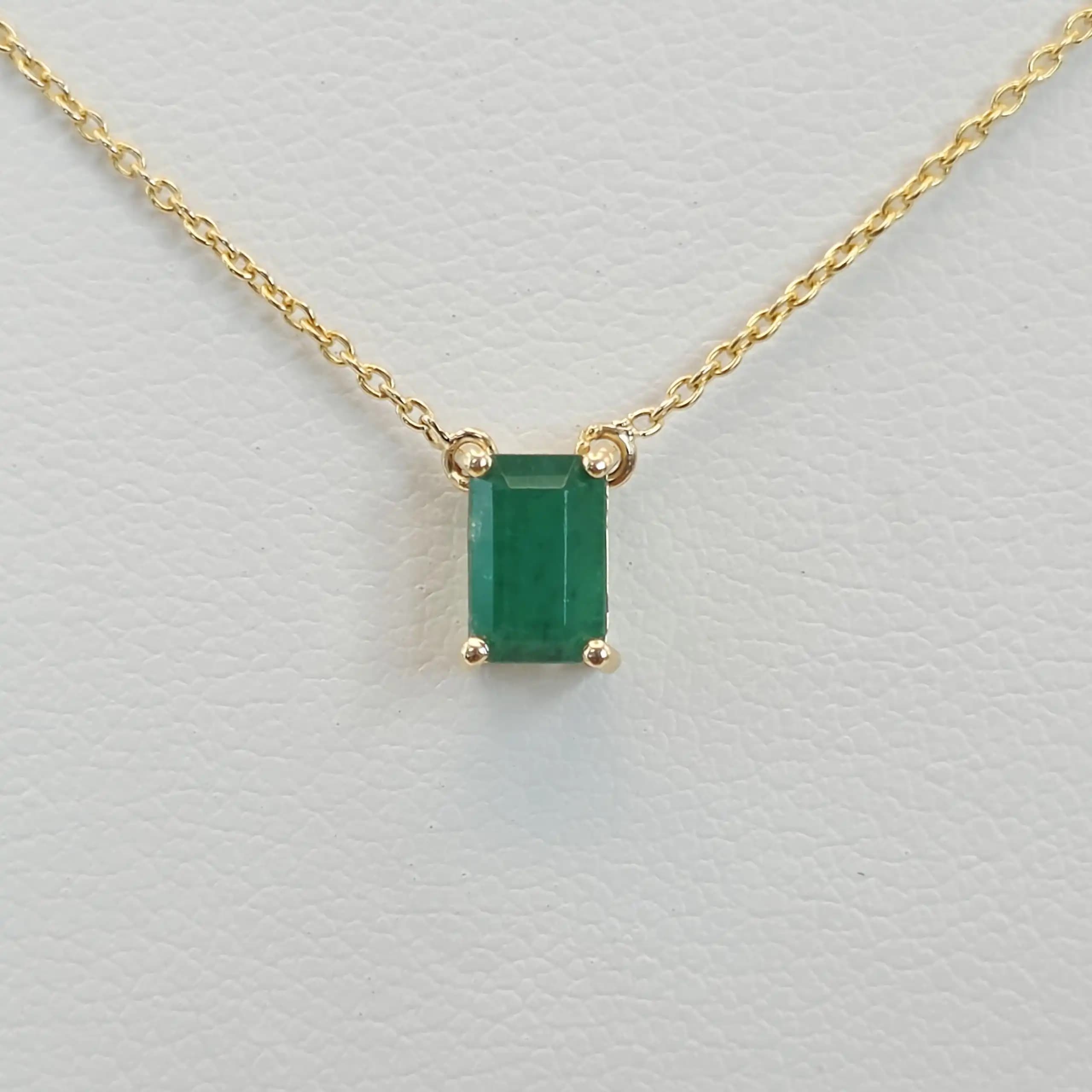 0.50 cts emerald cut natural emerald floating solitaire necklace in 14K yellow gold