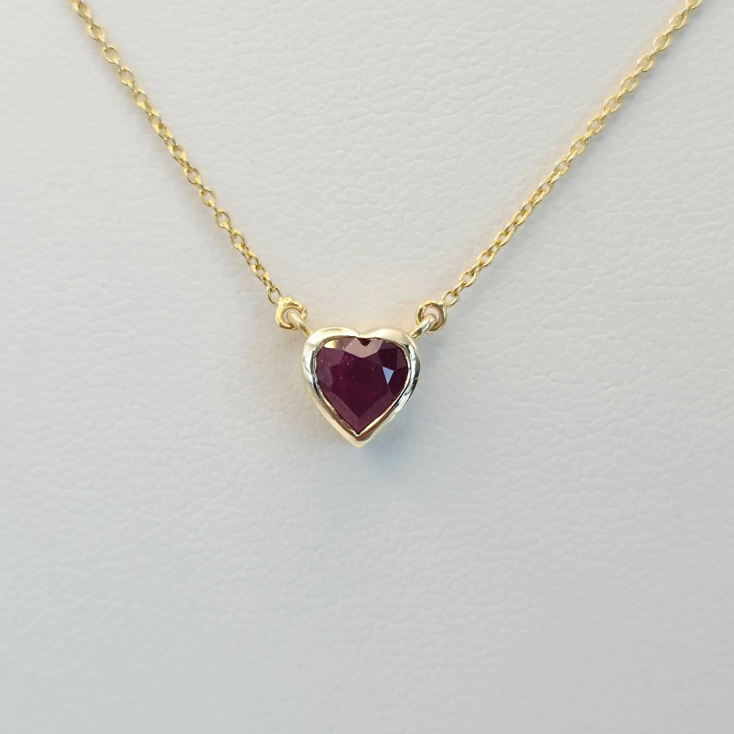 0.60 to 0.75 cts heart shape natural ruby bezel necklace in 14K yellow gold