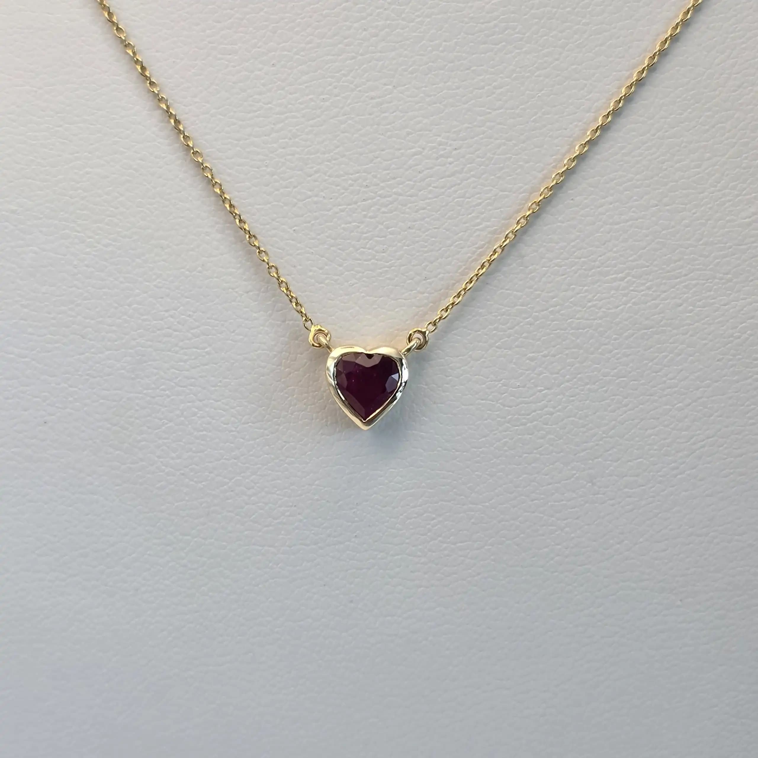 0.60 to 0.75 cts heart shape natural ruby bezel necklace in 14K yellow gold
