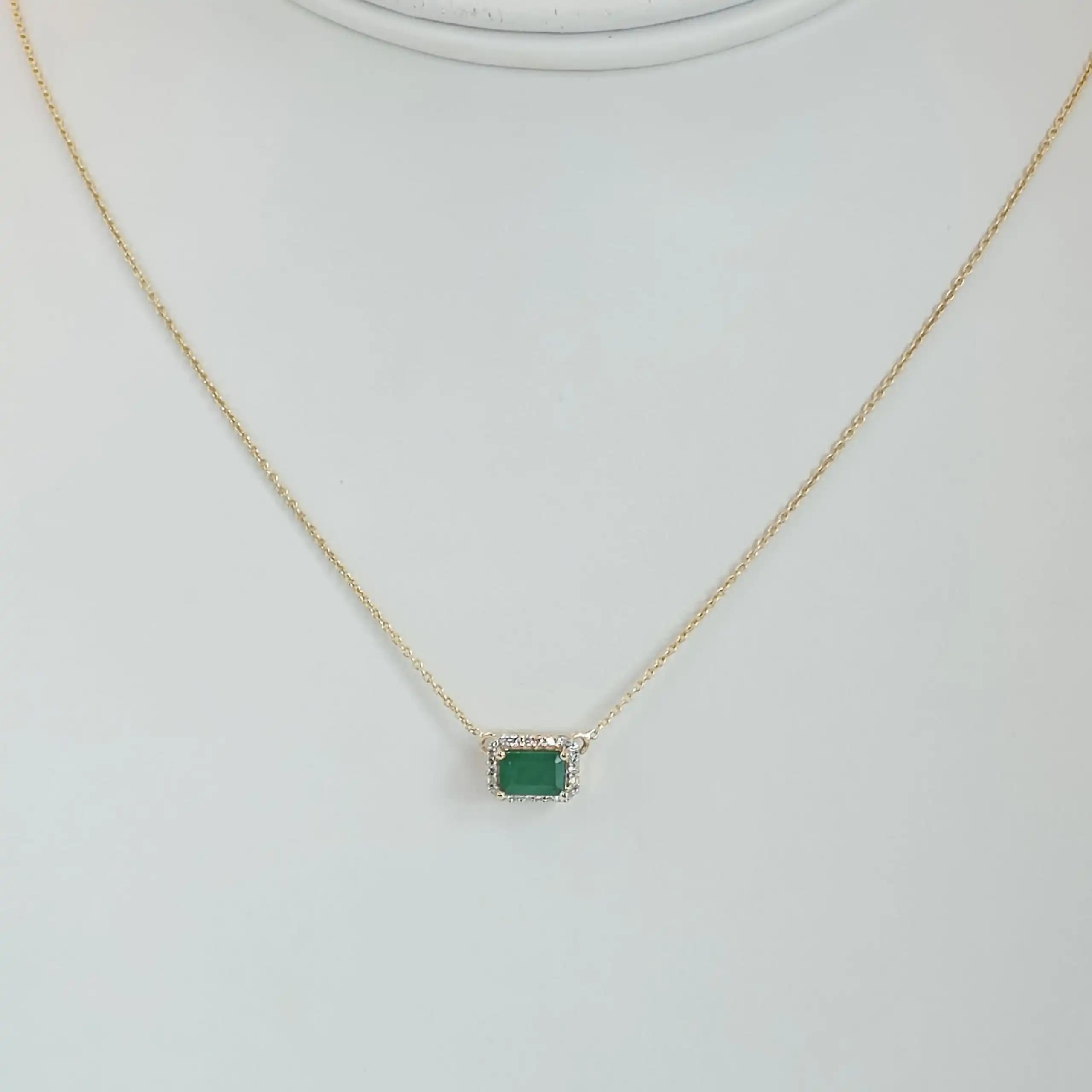 0.60 cts emerald cut natural emerald halo necklace in 14K yellow gold