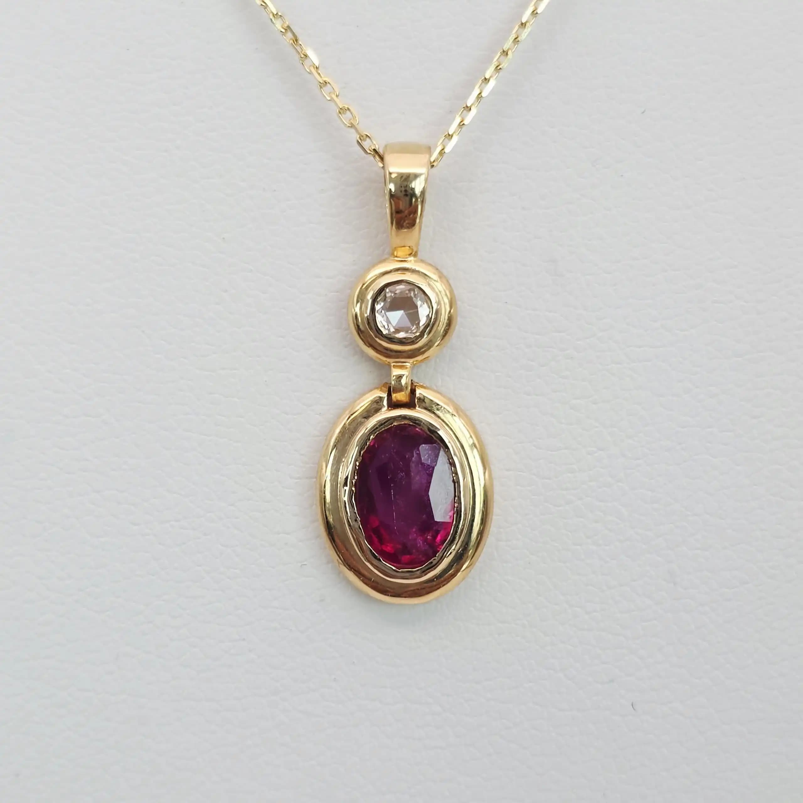 1.01 cts oval natural ruby and diamond drop pendant in 18K yellow gold