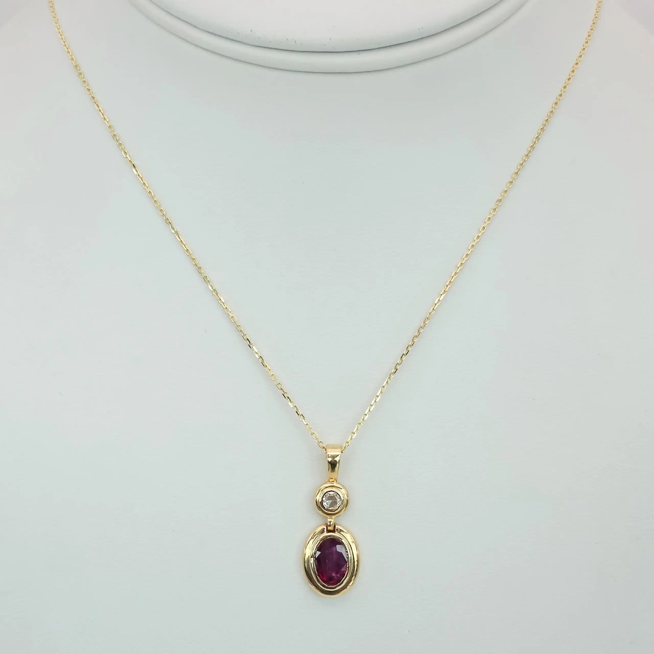 1.01 cts oval natural ruby and diamond drop pendant in 18K yellow gold