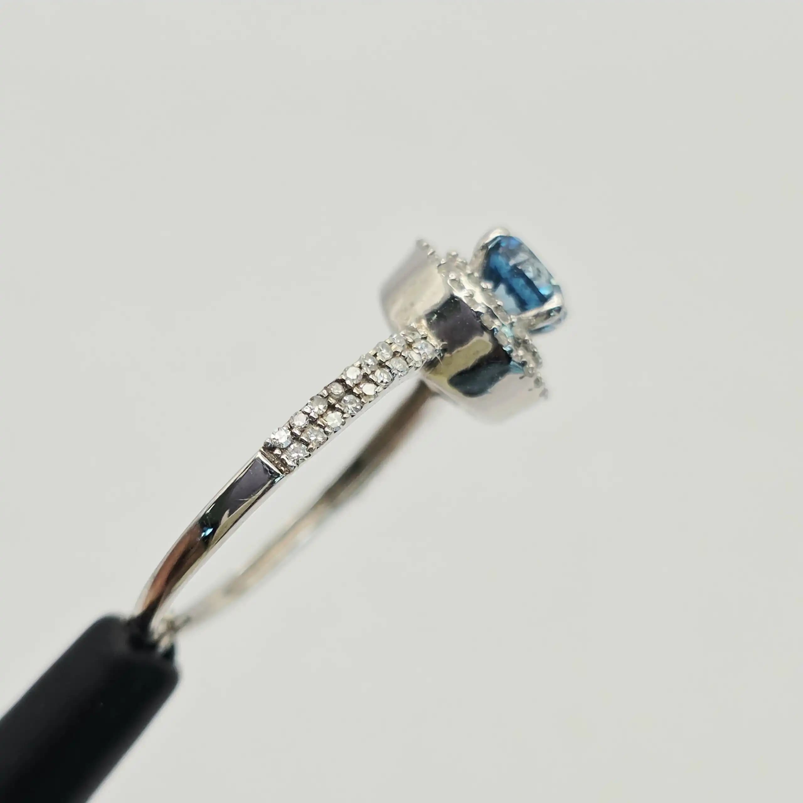 0.55 cts cushion natural blue gemstone and diamond halo ring in 14K white gold