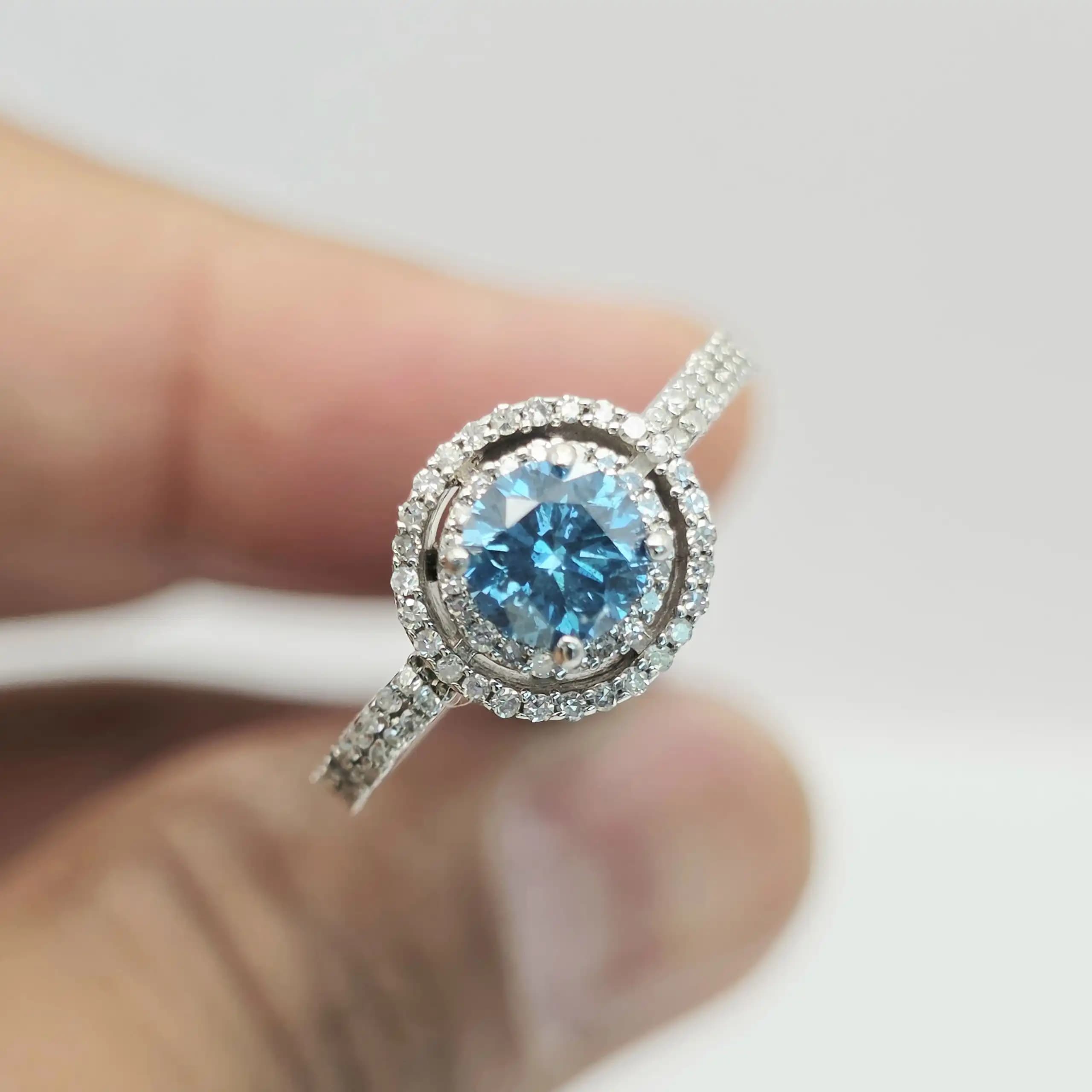 0.55 cts cushion natural blue gemstone and diamond halo ring in 14K white gold