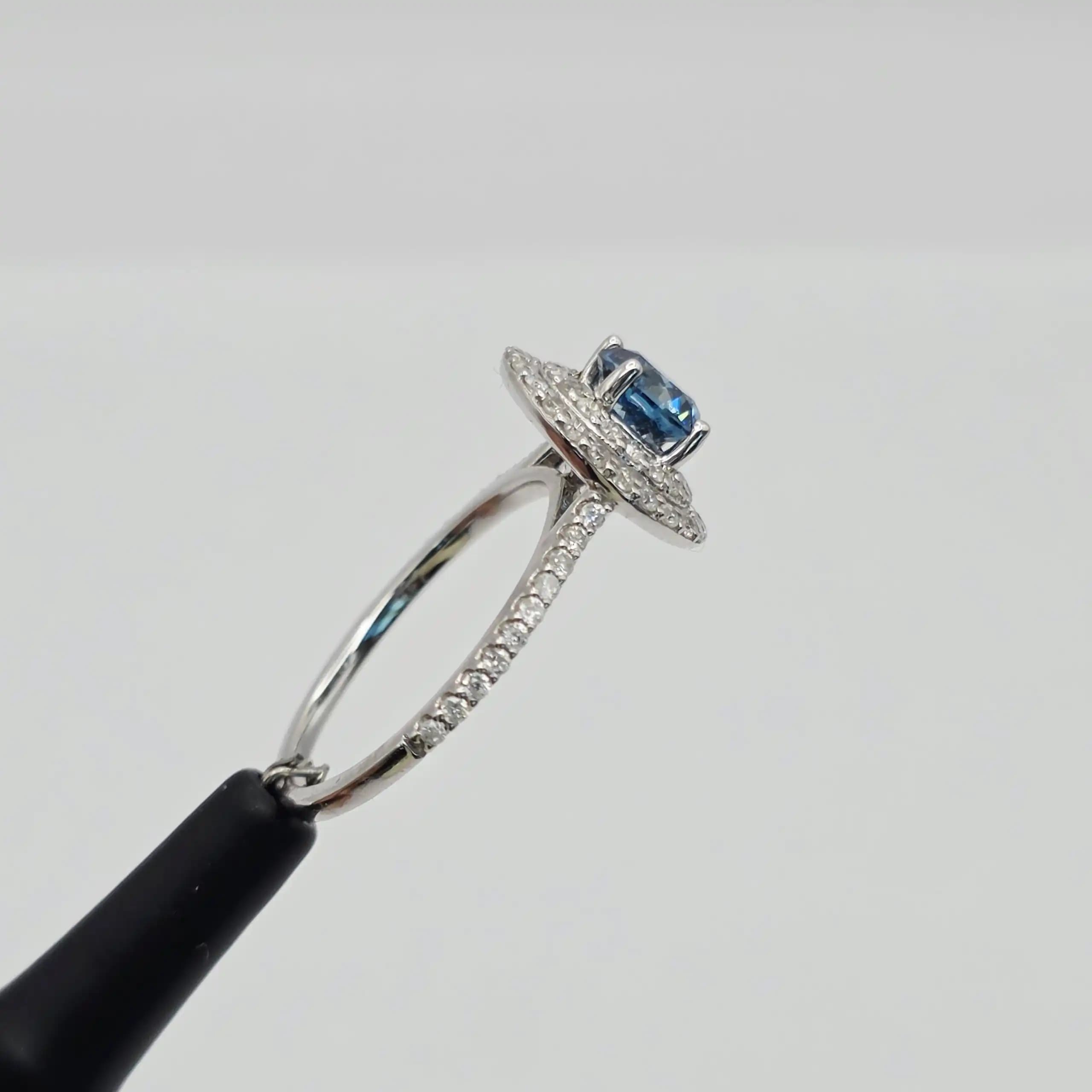1.25 cts natural blue gemstone and diamond halo ring in 14K white gold