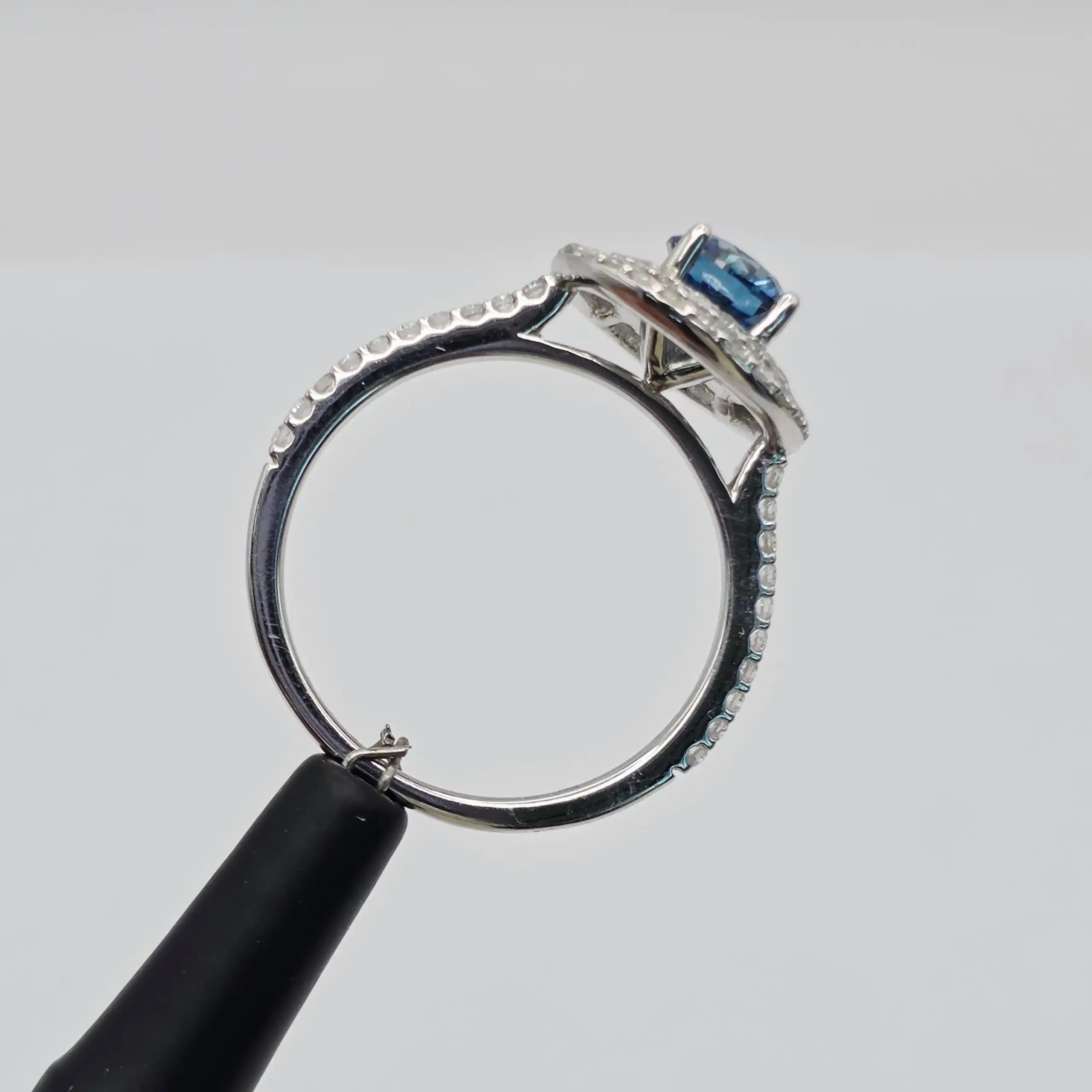 1.25 cts natural blue gemstone and diamond halo ring in 14K white gold