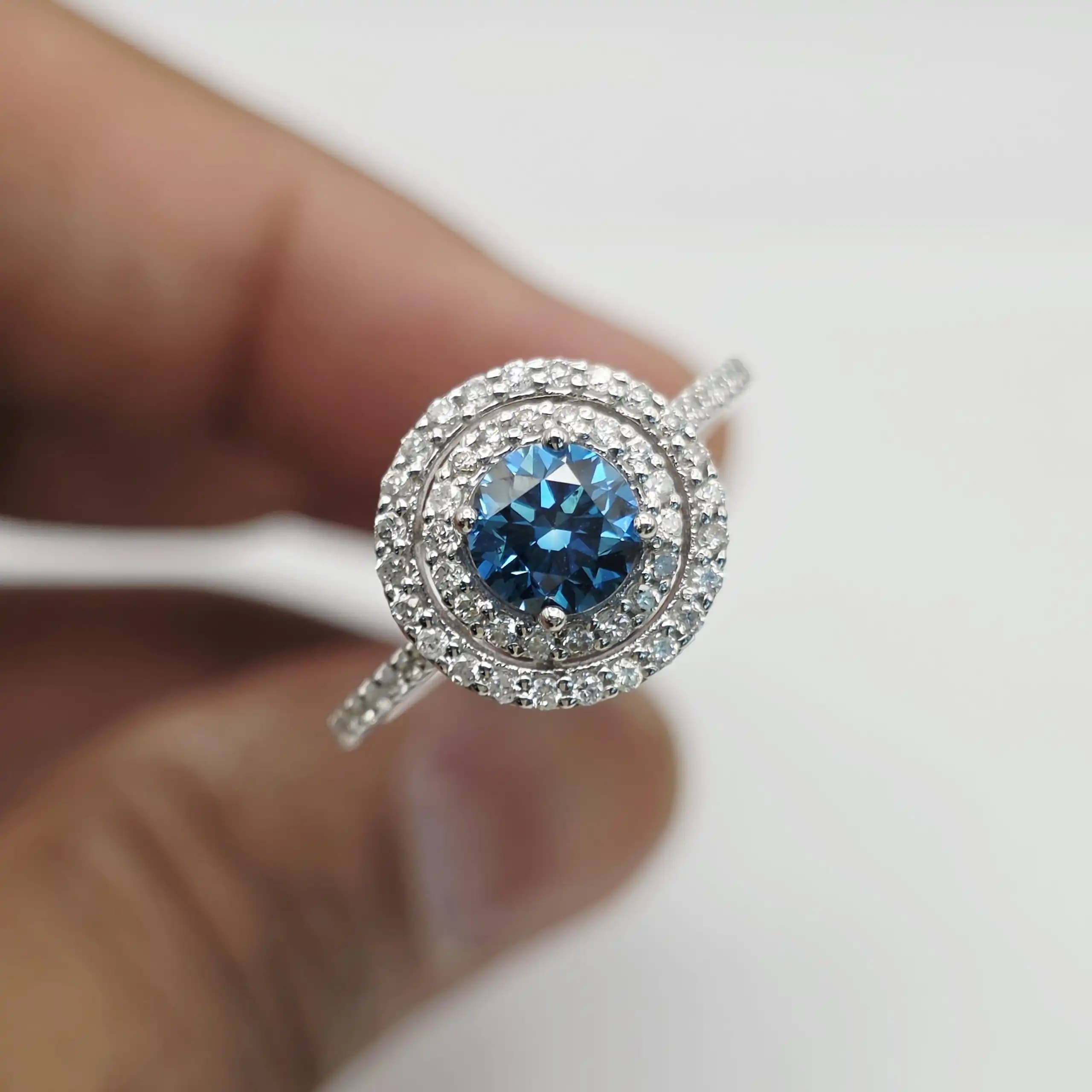 1.25 cts natural blue gemstone and diamond halo ring in 14K white gold