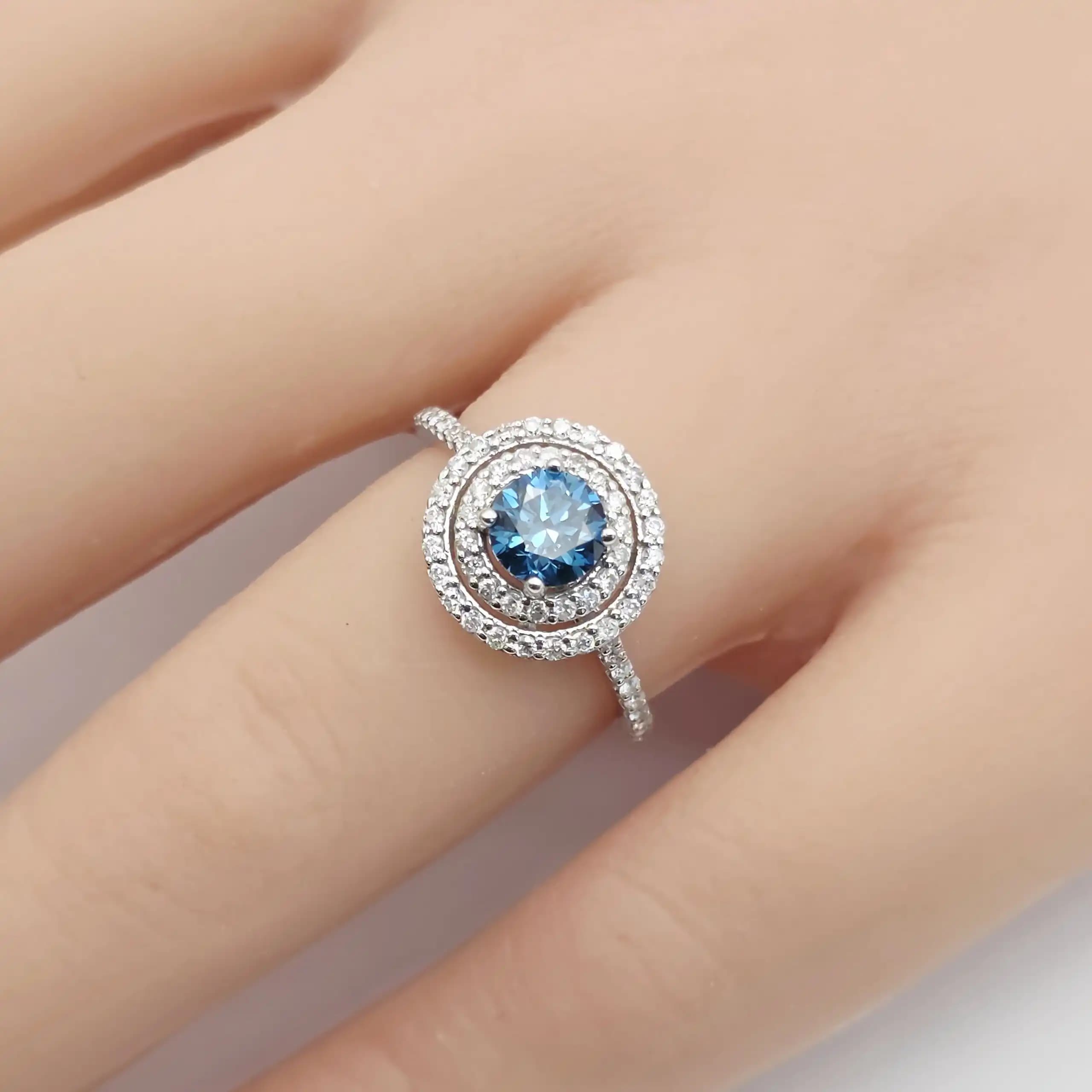 1.25 cts natural blue gemstone and diamond halo ring in 14K white gold