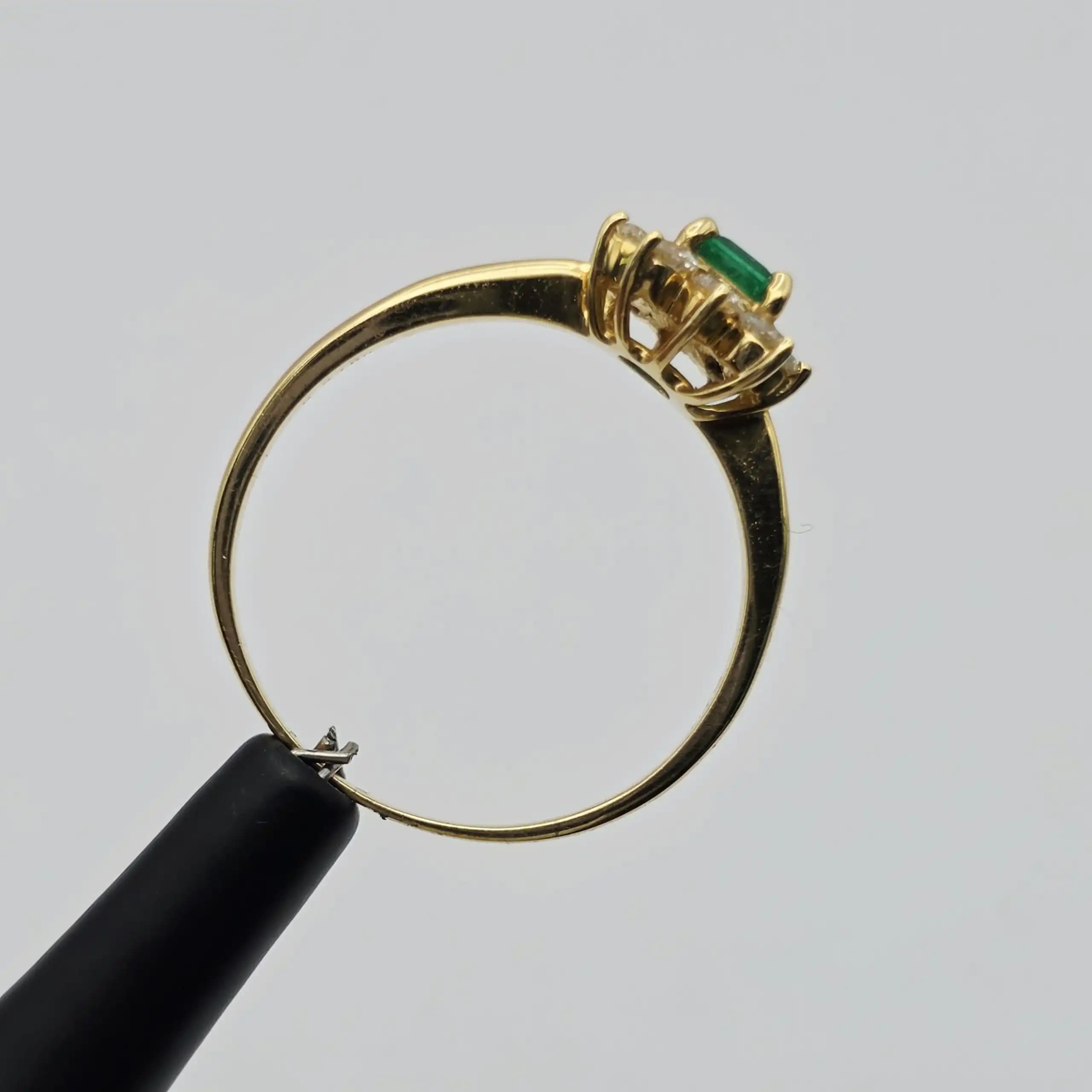 0.35 cts emerald cut natural emerald and diamond cluster ring in 18K yellow gold