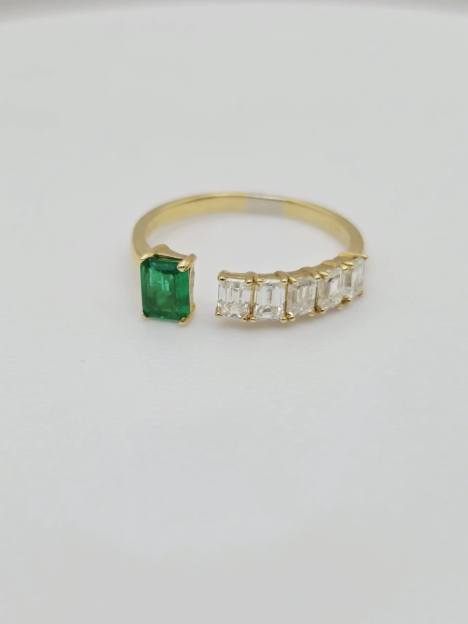 0.36 cts emerald cut natural emerald and diamond cluster ring in 18K yellow gold