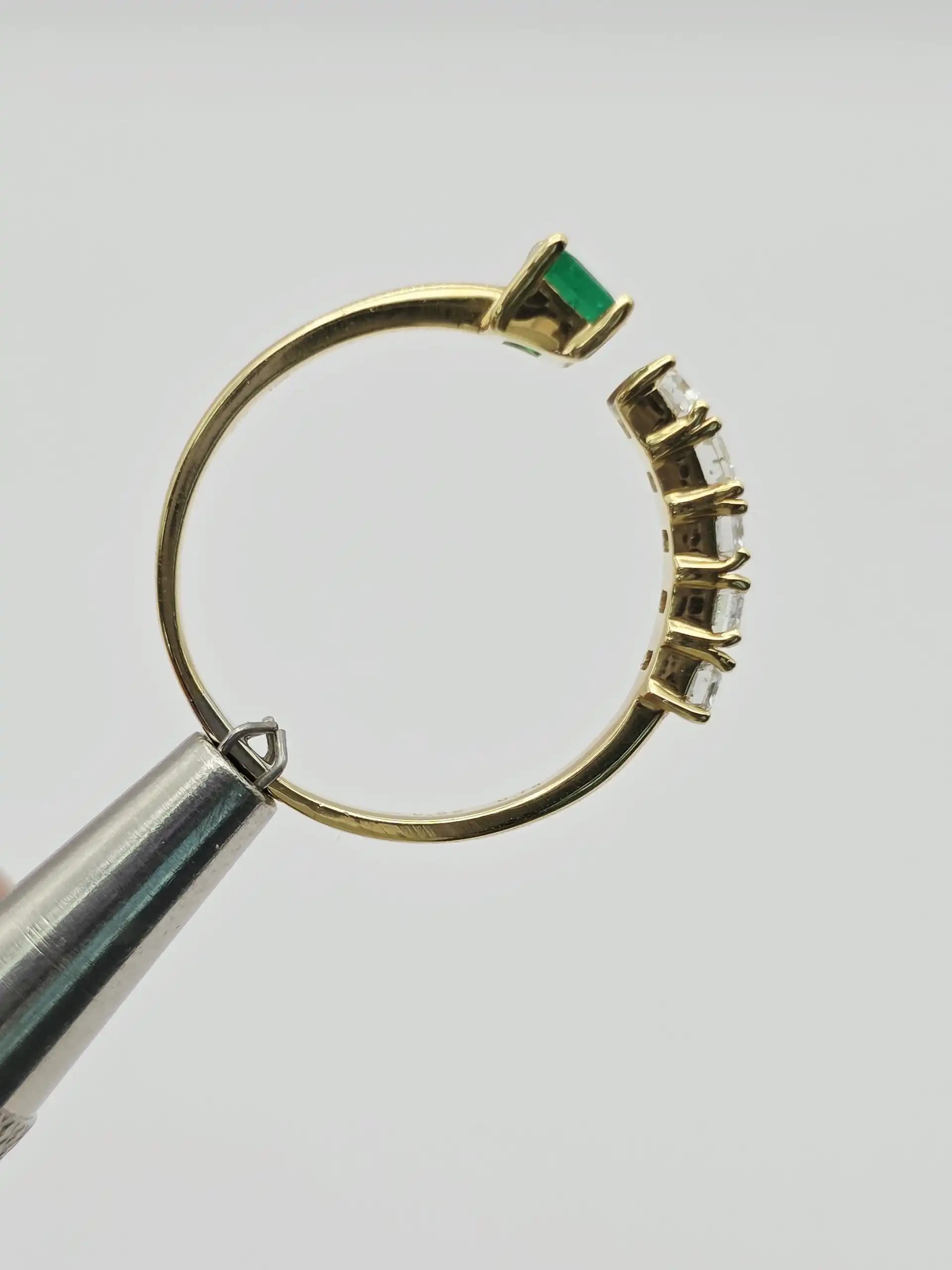 0.36 cts emerald cut natural emerald and diamond cluster ring in 18K yellow gold