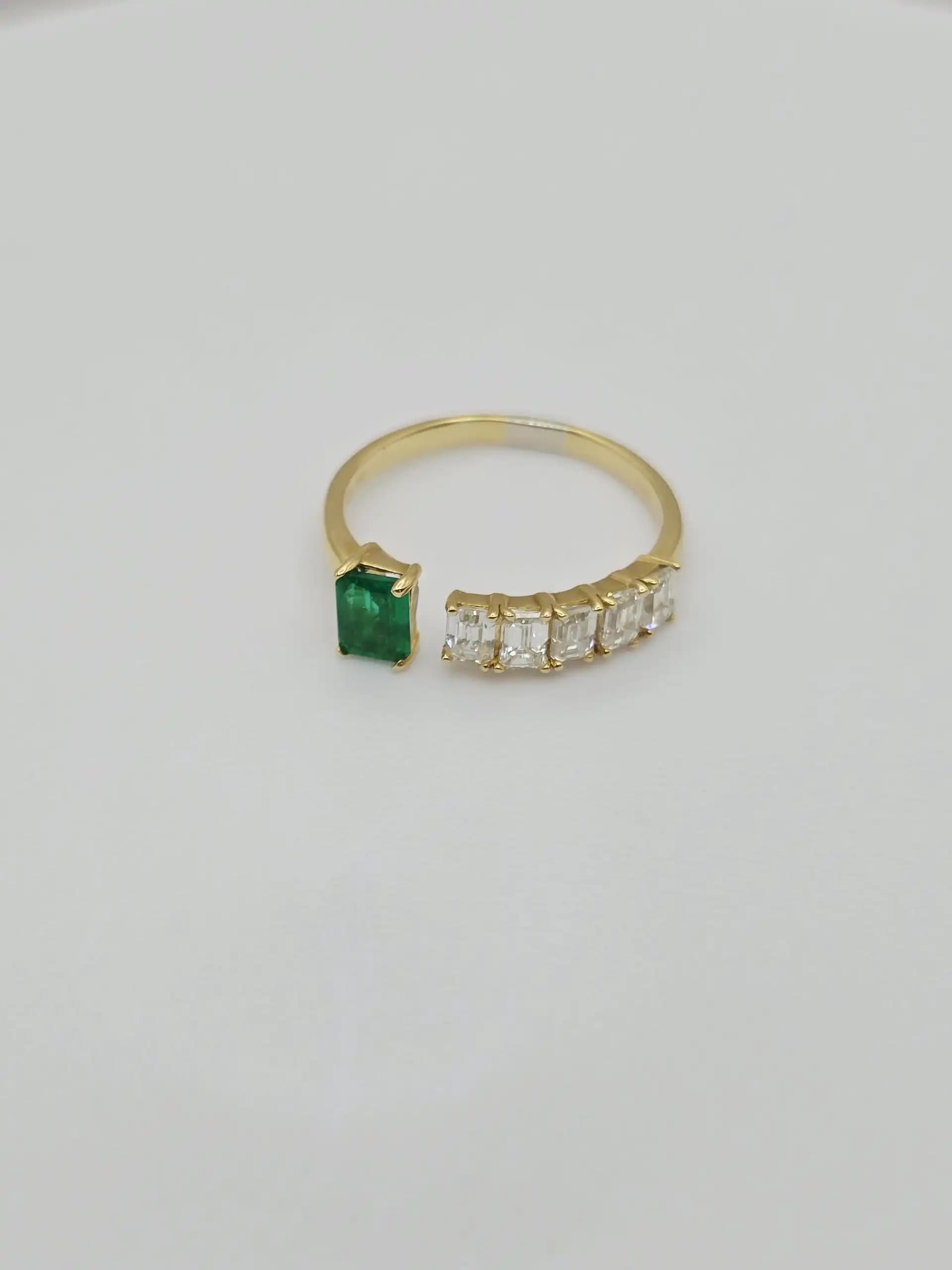 0.36 cts emerald cut natural emerald and diamond cluster ring in 18K yellow gold