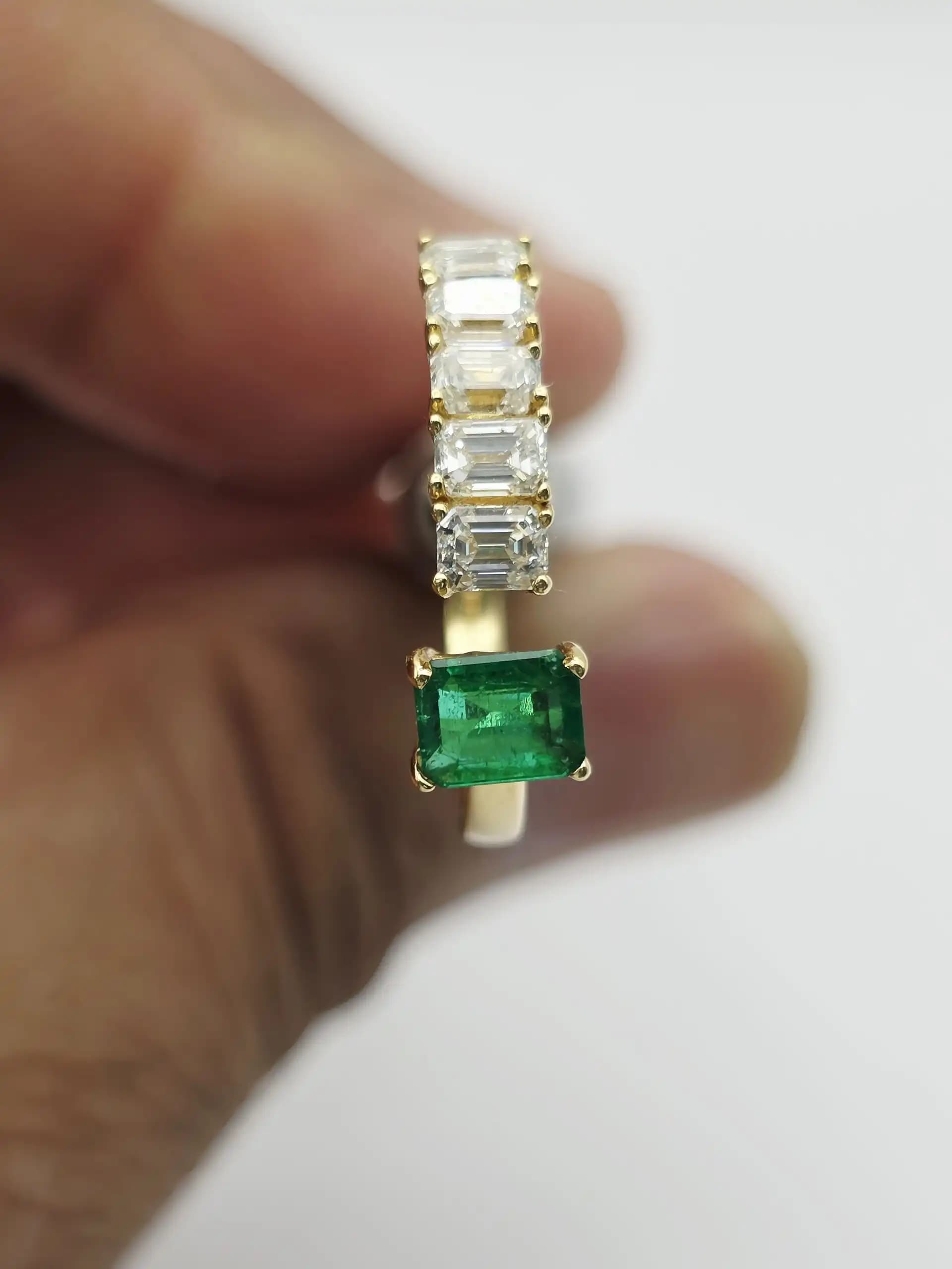 0.36 cts emerald cut natural emerald and diamond cluster ring in 18K yellow gold