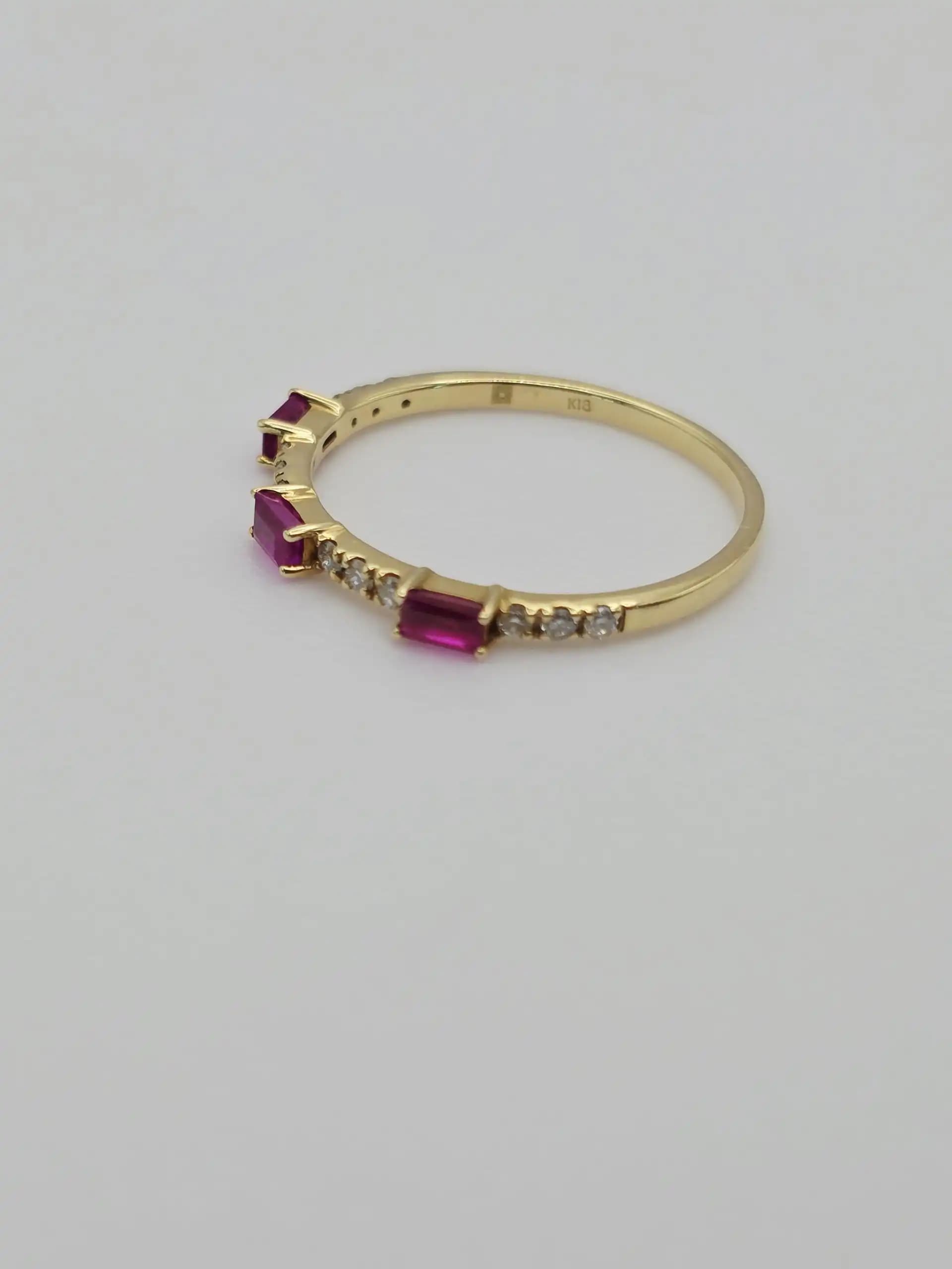 0.30 cts emerald cut natural ruby and diamond band ring in 18K yellow gold