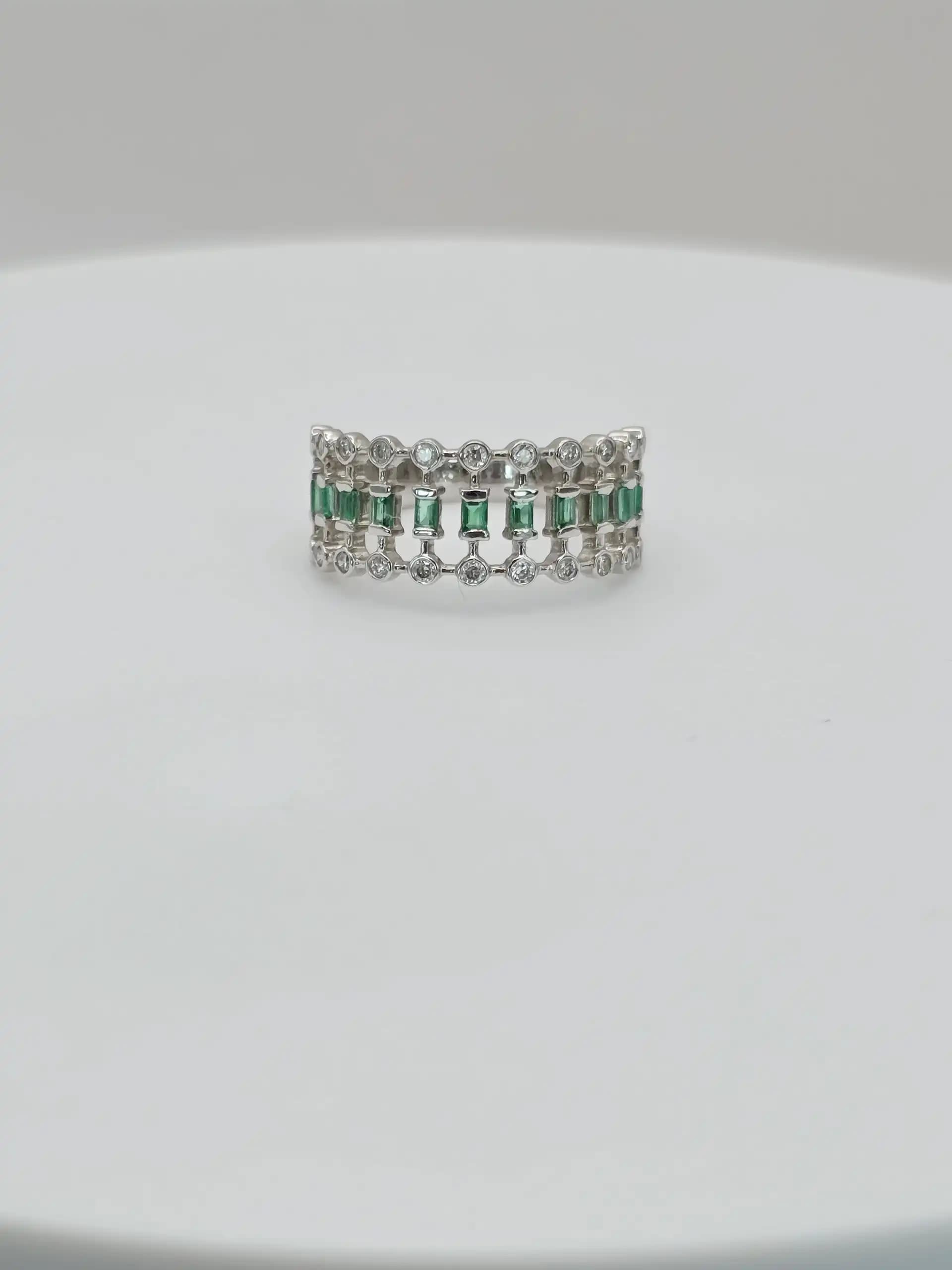 0.21 cts natural emerald and diamond wide band ring in 18K white gold