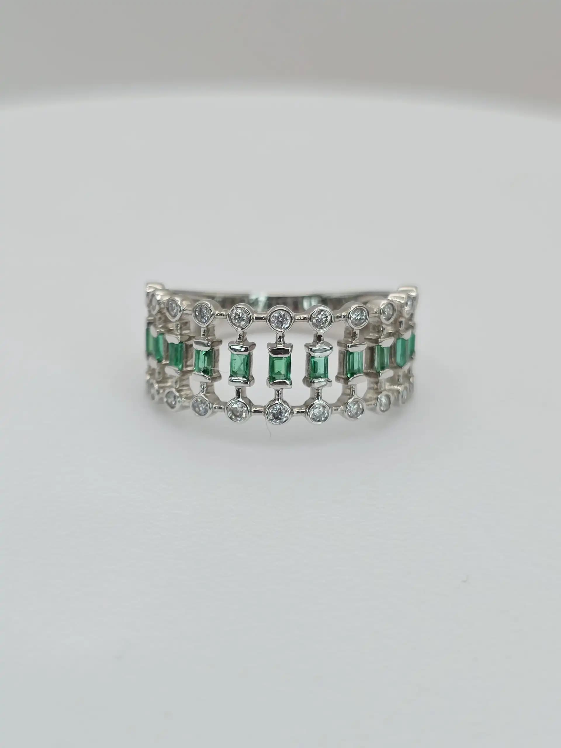 0.21 cts natural emerald and diamond wide band ring in 18K white gold