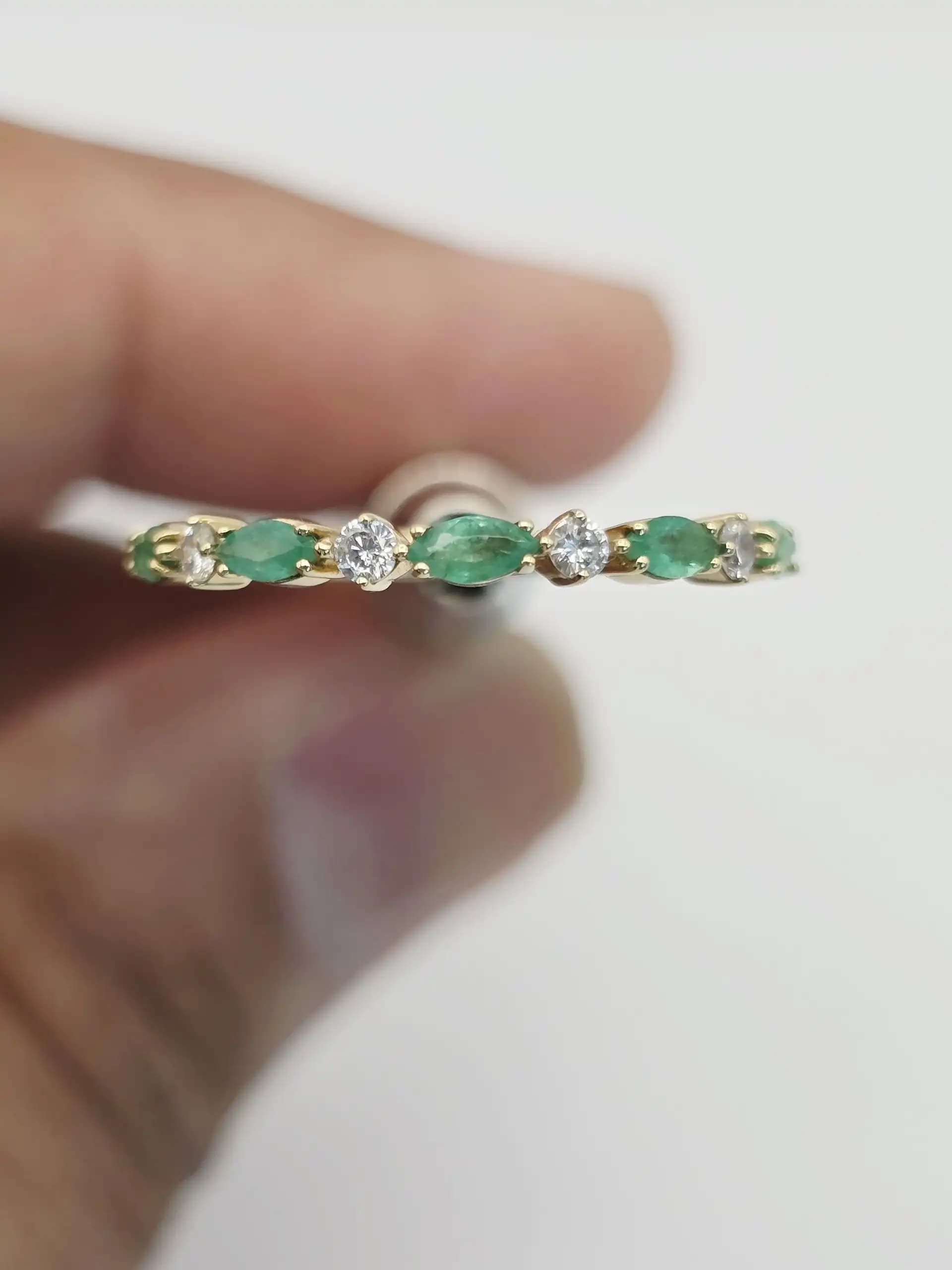 0.37 cts oval natural emerald and diamond band ring in 18K yellow gold